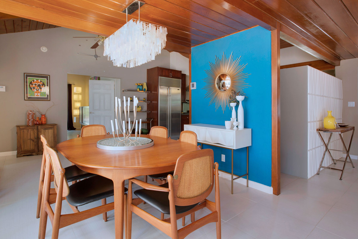 mid-century-dining-room-with-cherry-wood-ceiling-and-turquoise-accent-wall