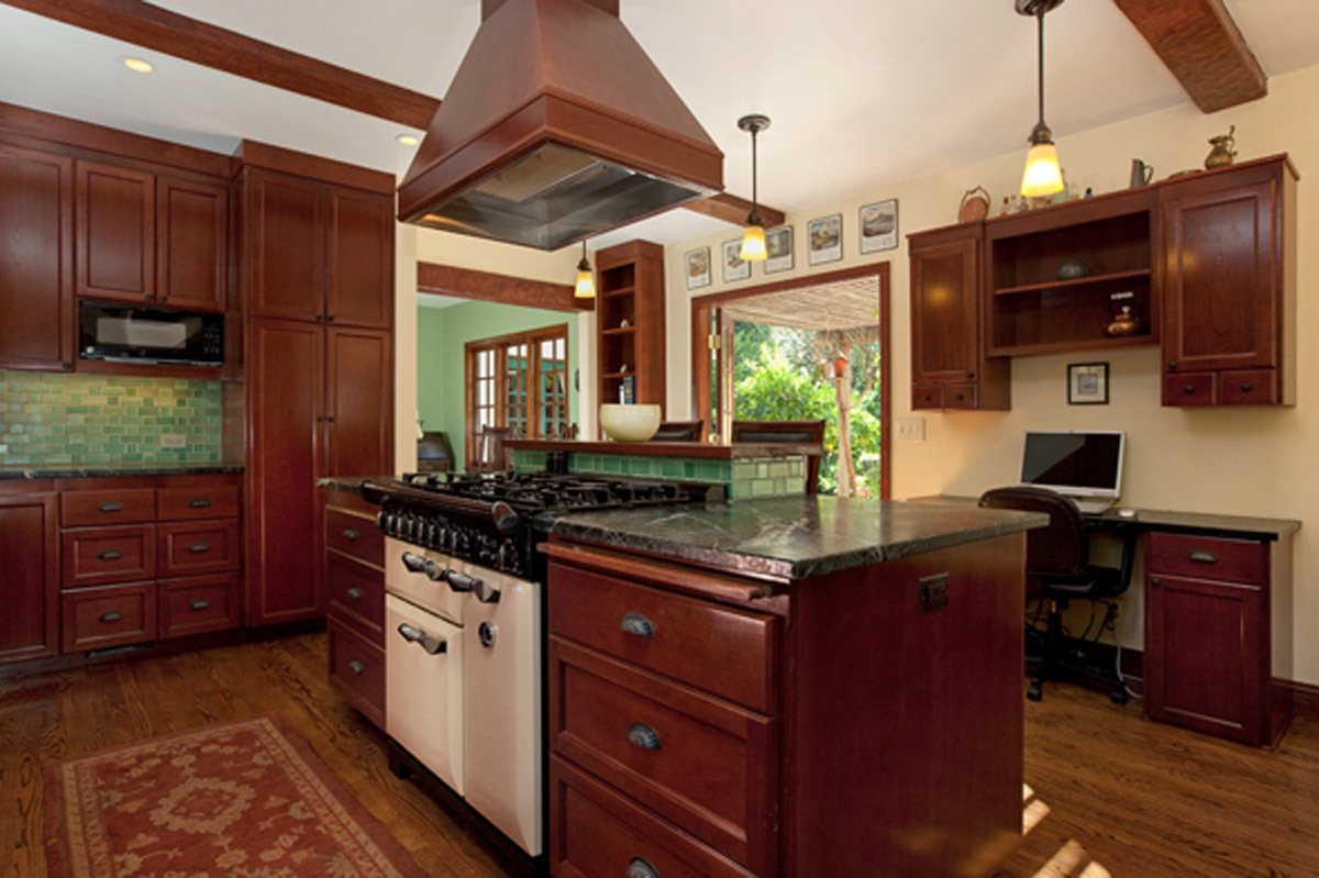 dark-wood-kitchen-with-island-and-green-subway-tile