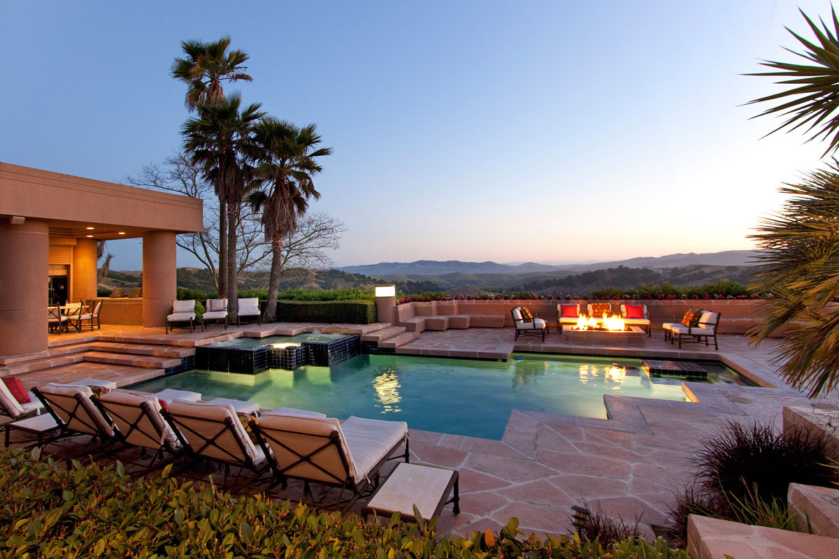 pool-cabana-palm-tree-fire-pit-at-twilight