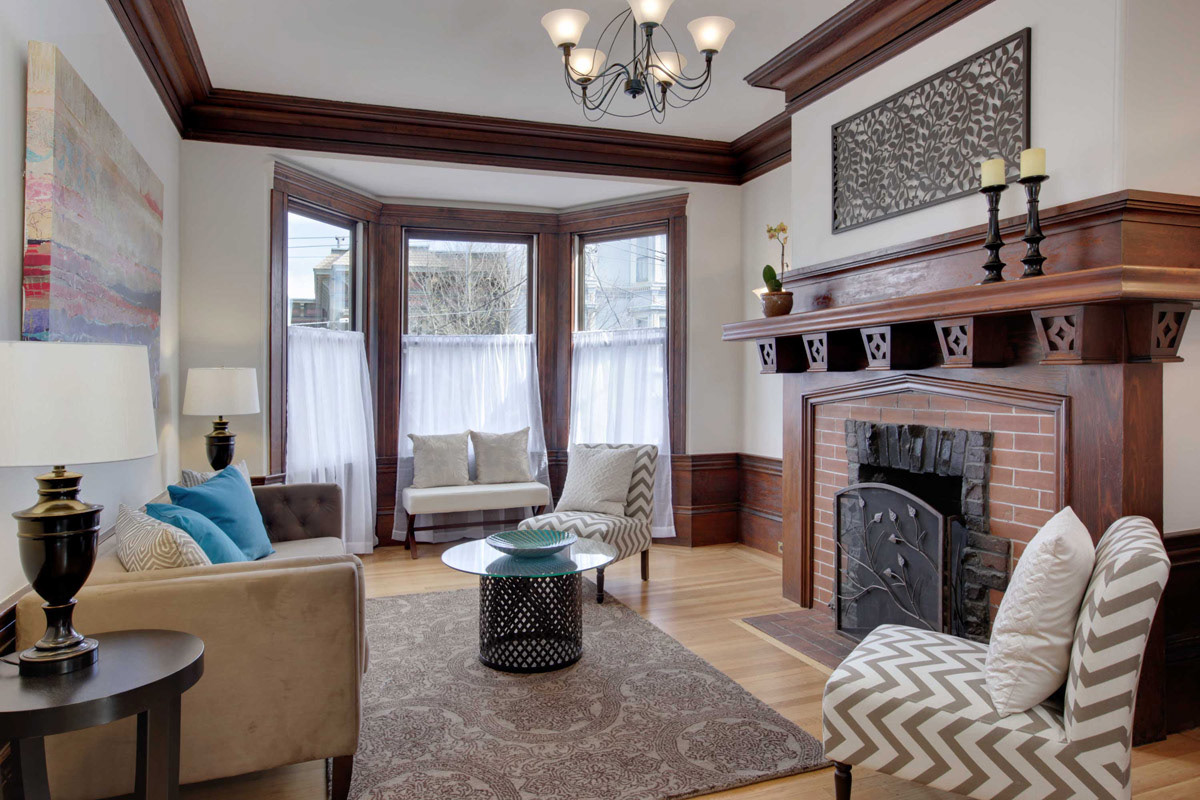 victorian-style-livingroom-with craftsman-wood-and-brick-fireplace