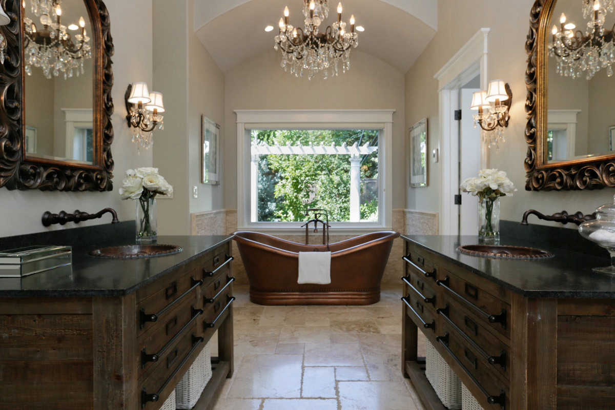 elehgant-bathroom-with-twin-wood-vanities-carved-mirrors-vintage-style-copper-tub-and-crystal-chandeliercopper