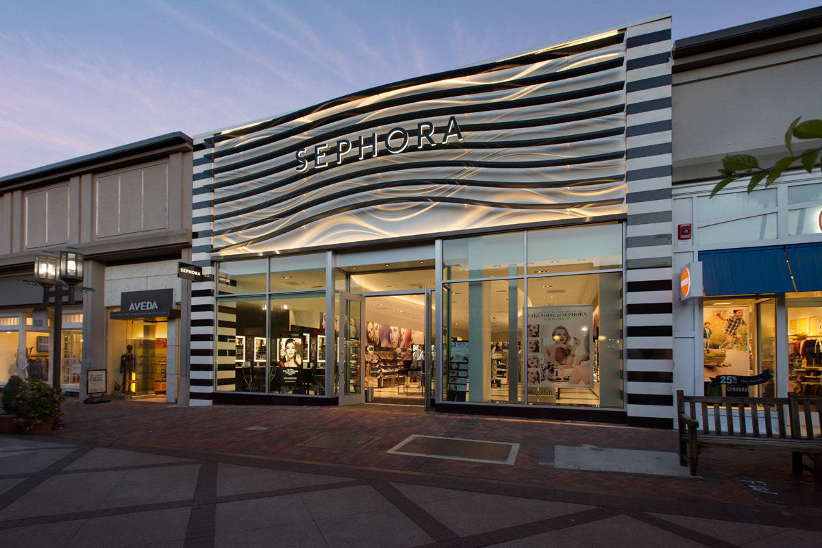 exterior-of-cosmetics-store-with-black-and-white-wavy-lines-on-facade-at-twilight
