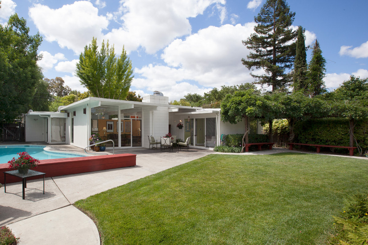 white-mid-century-modern-Eichler-home-with-pool-and-lawn