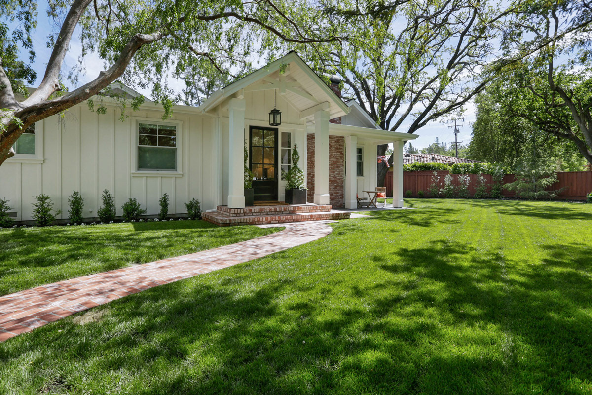 peaked-front-porch-roof-glass-entrydoor-and-brick-walkway