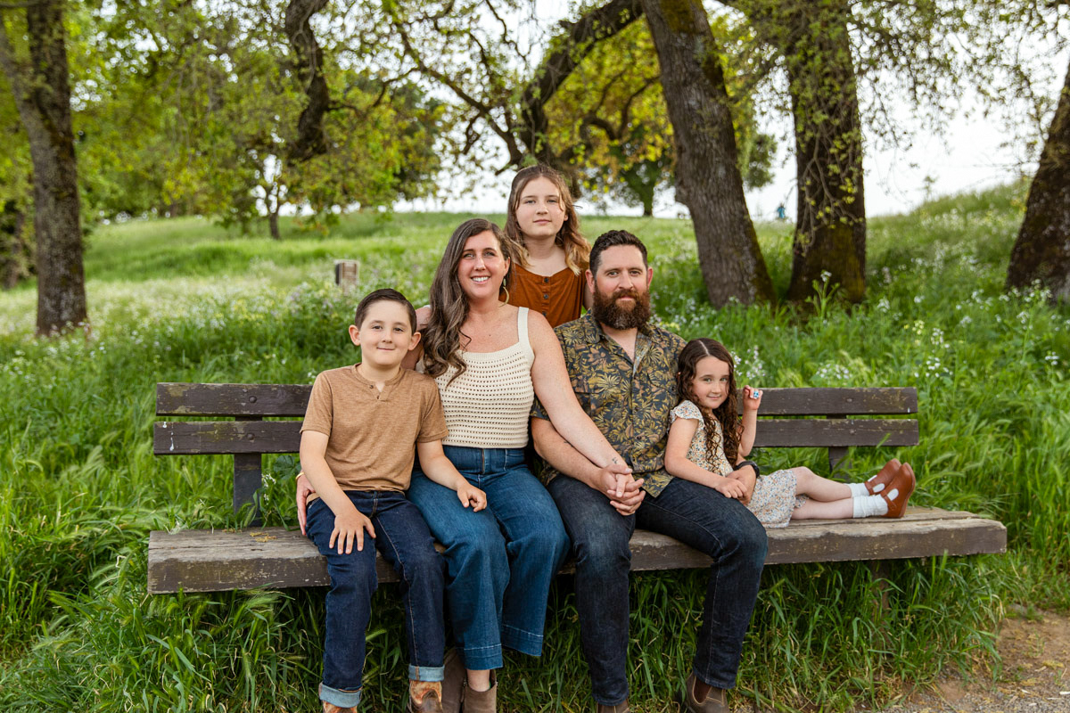 family-of-five-on-Napa-Wine-Country-park-bench