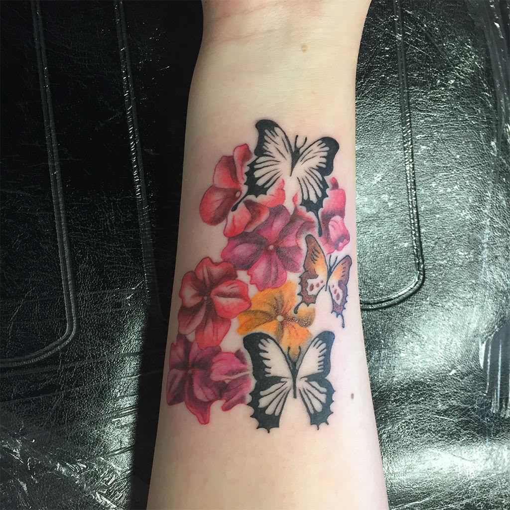 Colour flowers and butterflies tattoo