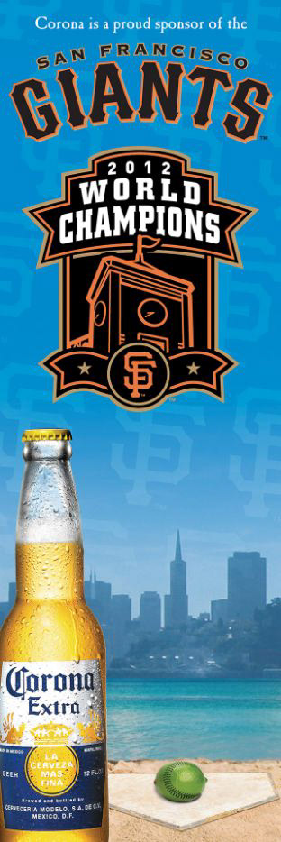 Tall Corona sponsorship banner celebrating the San Francisco Giants as 2012 World Champions, with a beverage bottle and San Francisco skyline.