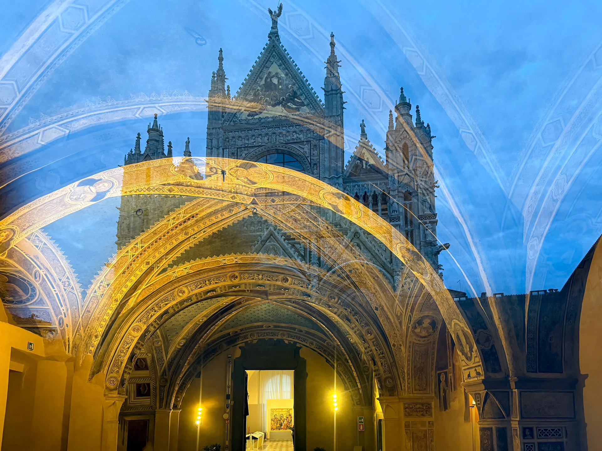 Siena Cathedral reflecting on Church window across the street