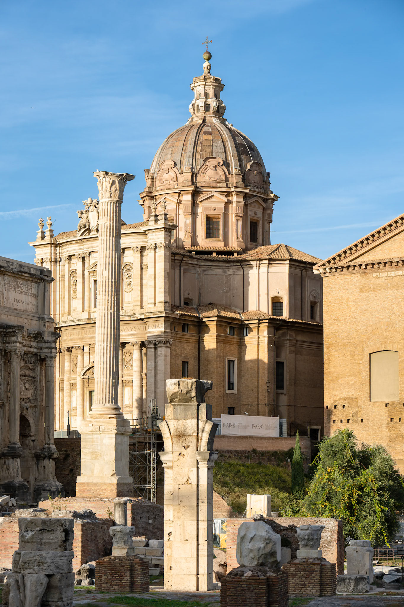 Soft evening light paints the Roman Forum