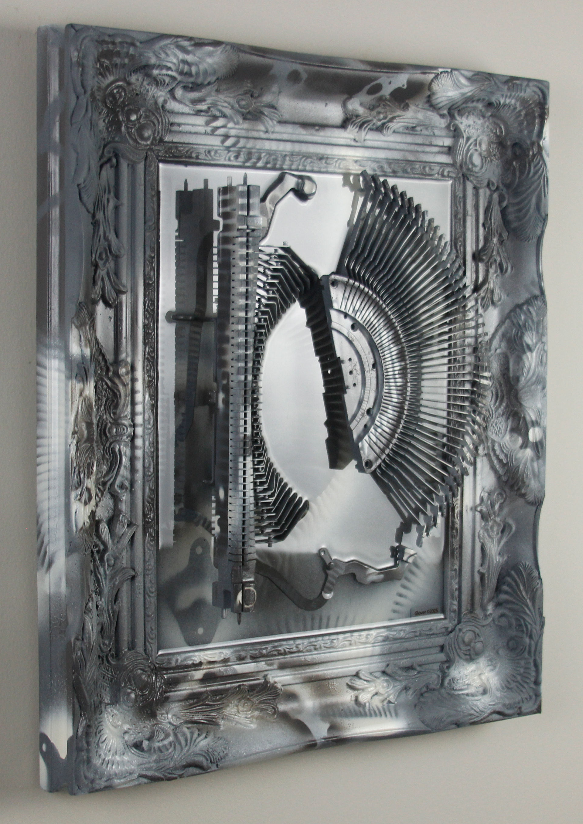 Shifting Satiation; $2200 (H:20” x W:17” x D:2.5”) Typewriter parts, spray paint, epoxy resin, wood base 