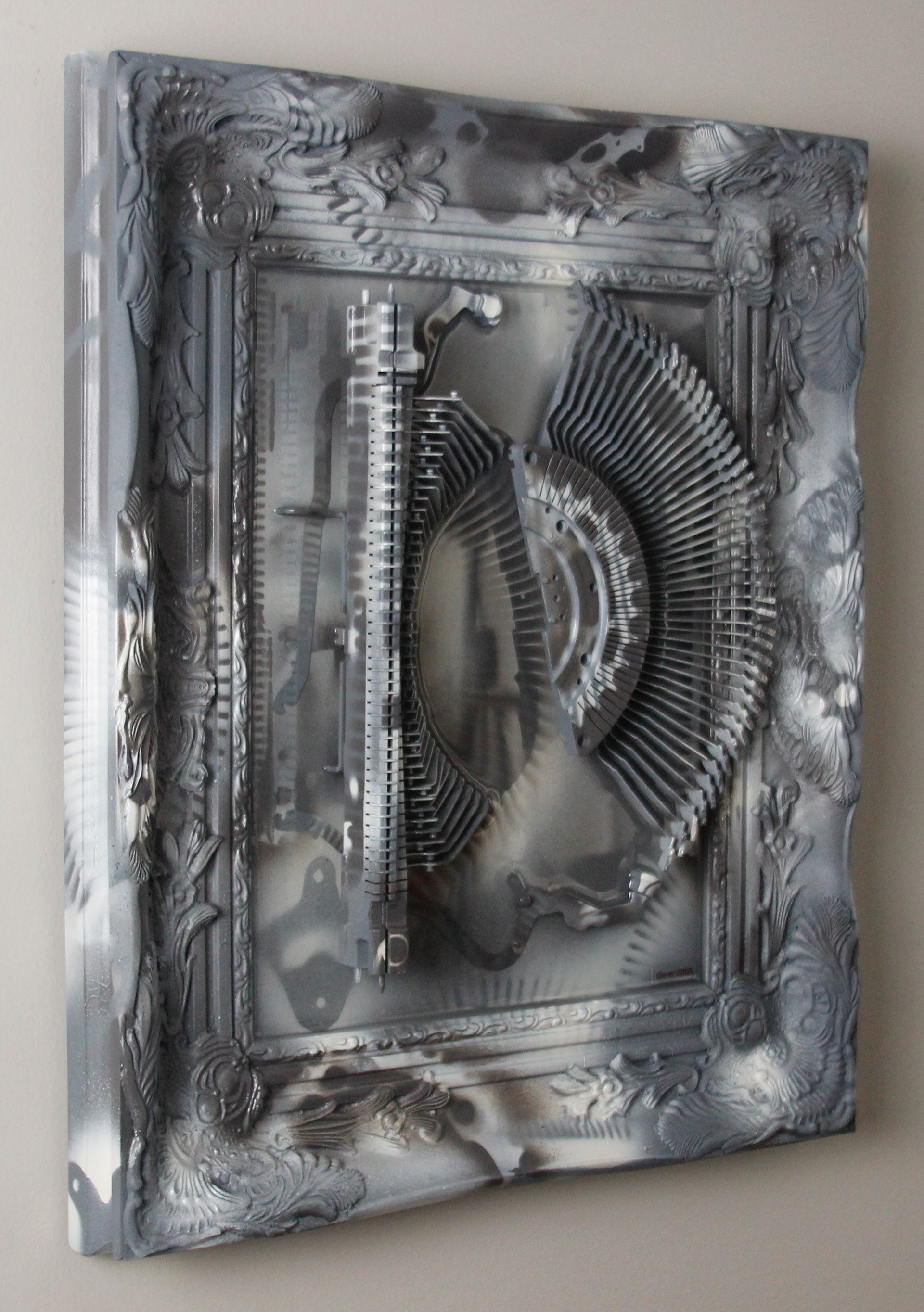 Shifting Satiation; $2200 (H:20” x W:17” x D:2.5”) Typewriter parts, spray paint, epoxy resin, wood base 