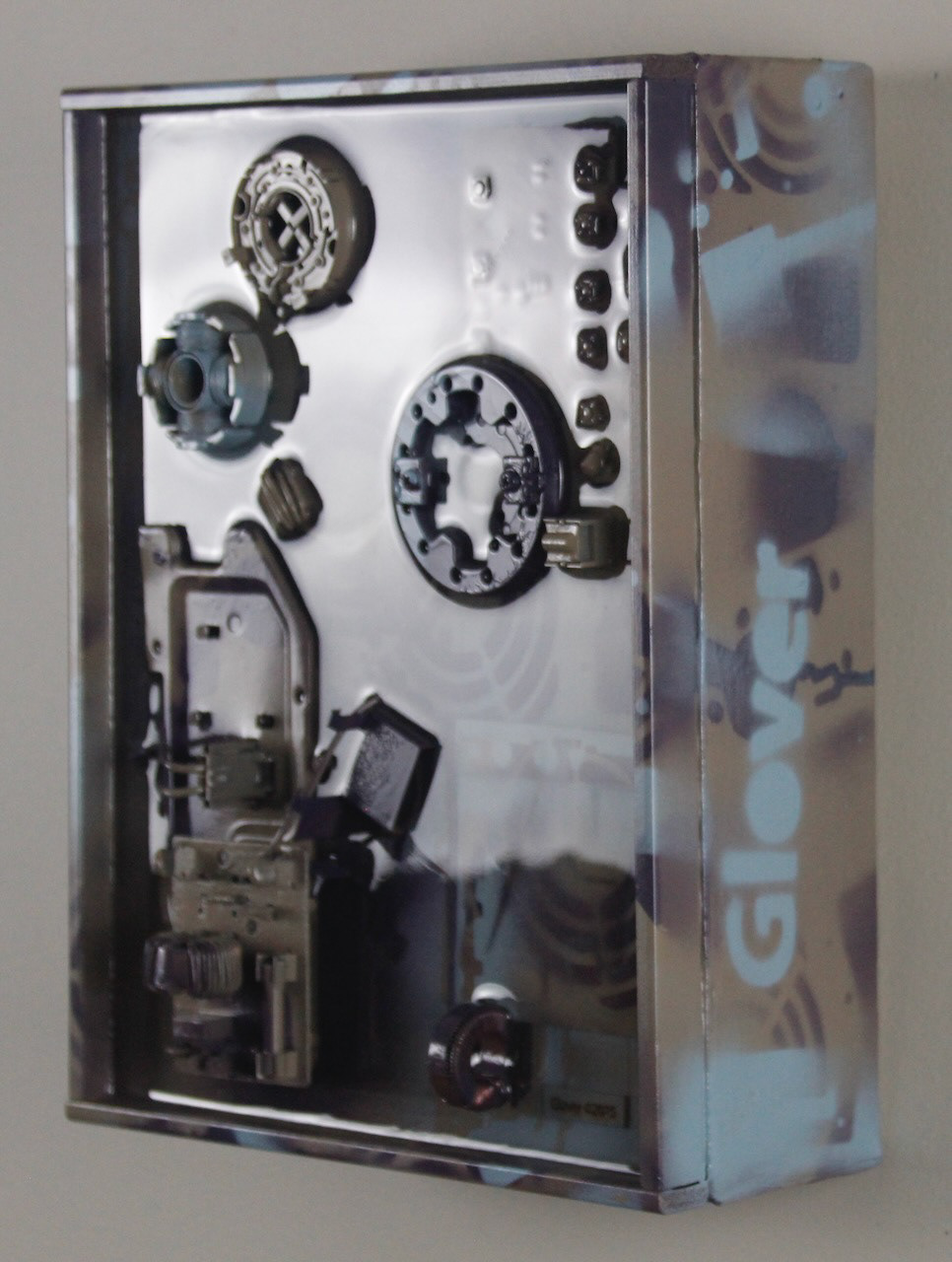 Times and Seasons; SOLD (H:12” x W:9” x D:5”) Assorted machine and computer parts, license plate section, spray paint, epoxy resin, canvas covered wood frame