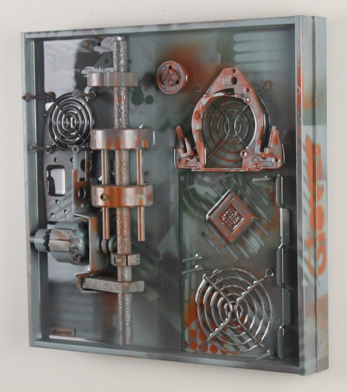 Omega Three; SOLD (H:12” x W:12” x D:3.25”) Assorted machine and computer parts, spray paint, epoxy resin, wood base