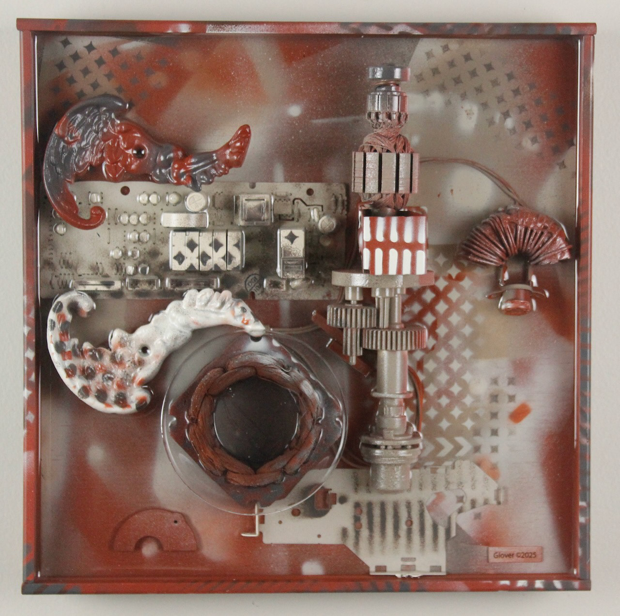 It spreads its wings to catch them and carries them off.; $990 (H:12” x W:12” x D:3.5”) Decorative lamp parts, machine parts, computer circuits, hand drill innards, spray paint, epoxy resin, wood base