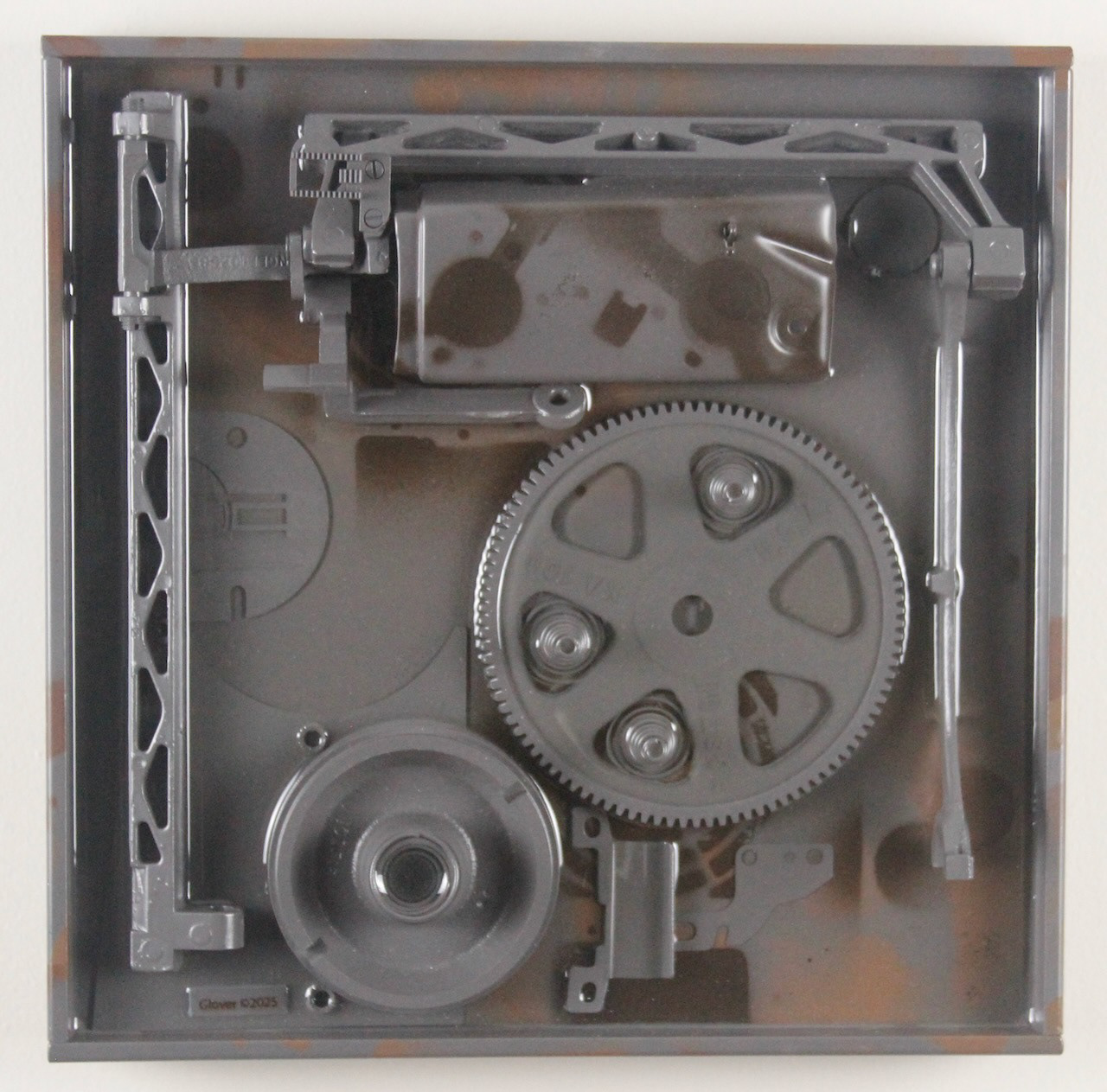 Deep Springs Below; $940 (H:12” x W:12” x D:2.75”) Assorted machine parts, spray paint, epoxy resin, wood base