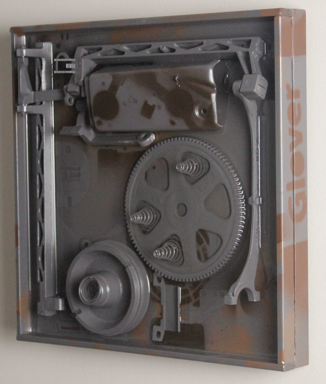 Deep Springs Below; $940 (H:12” x W:12” x D:2.75”) Assorted machine parts, spray paint, epoxy resin, wood base