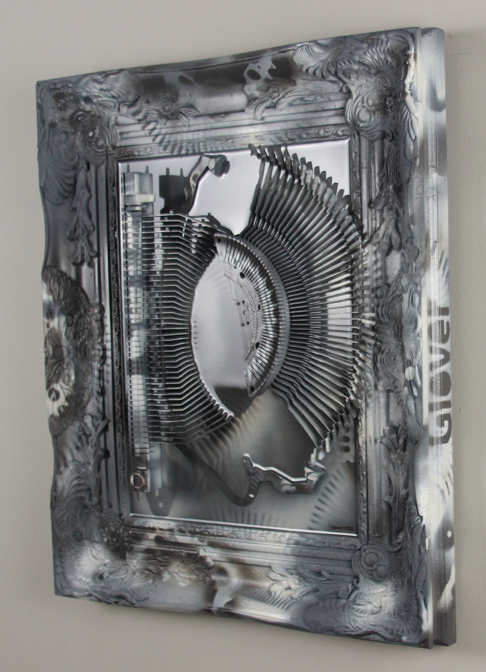 Shifting Satiation; $2200 (H:20” x W:17” x D:2.5”) Typewriter parts, spray paint, epoxy resin, wood base 