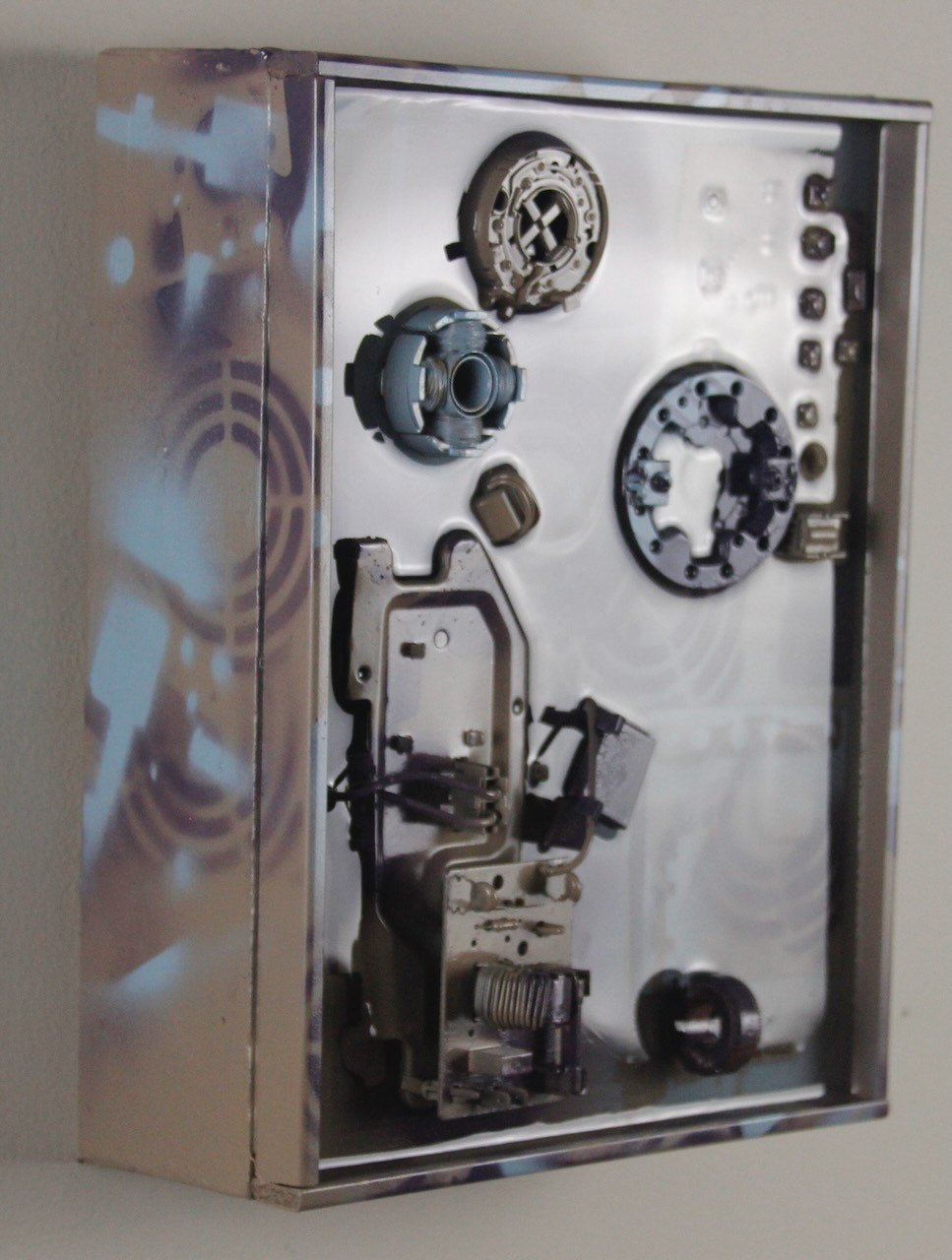 Times and Seasons; SOLD (H:12” x W:9” x D:5”) Assorted machine and computer parts, license plate section, spray paint, epoxy resin, canvas covered wood frame