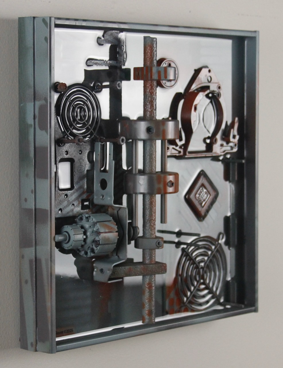 Omega Three; SOLD (H:12” x W:12” x D:3.25”) Assorted machine and computer parts, spray paint, epoxy resin, wood base