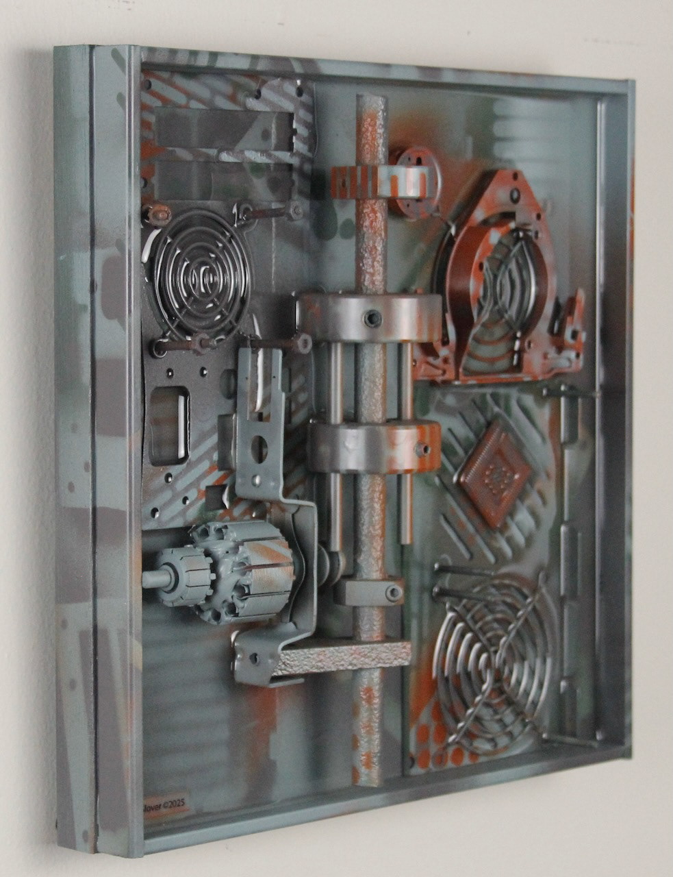 Omega Three; SOLD (H:12” x W:12” x D:3.25”) Assorted machine and computer parts, spray paint, epoxy resin, wood base