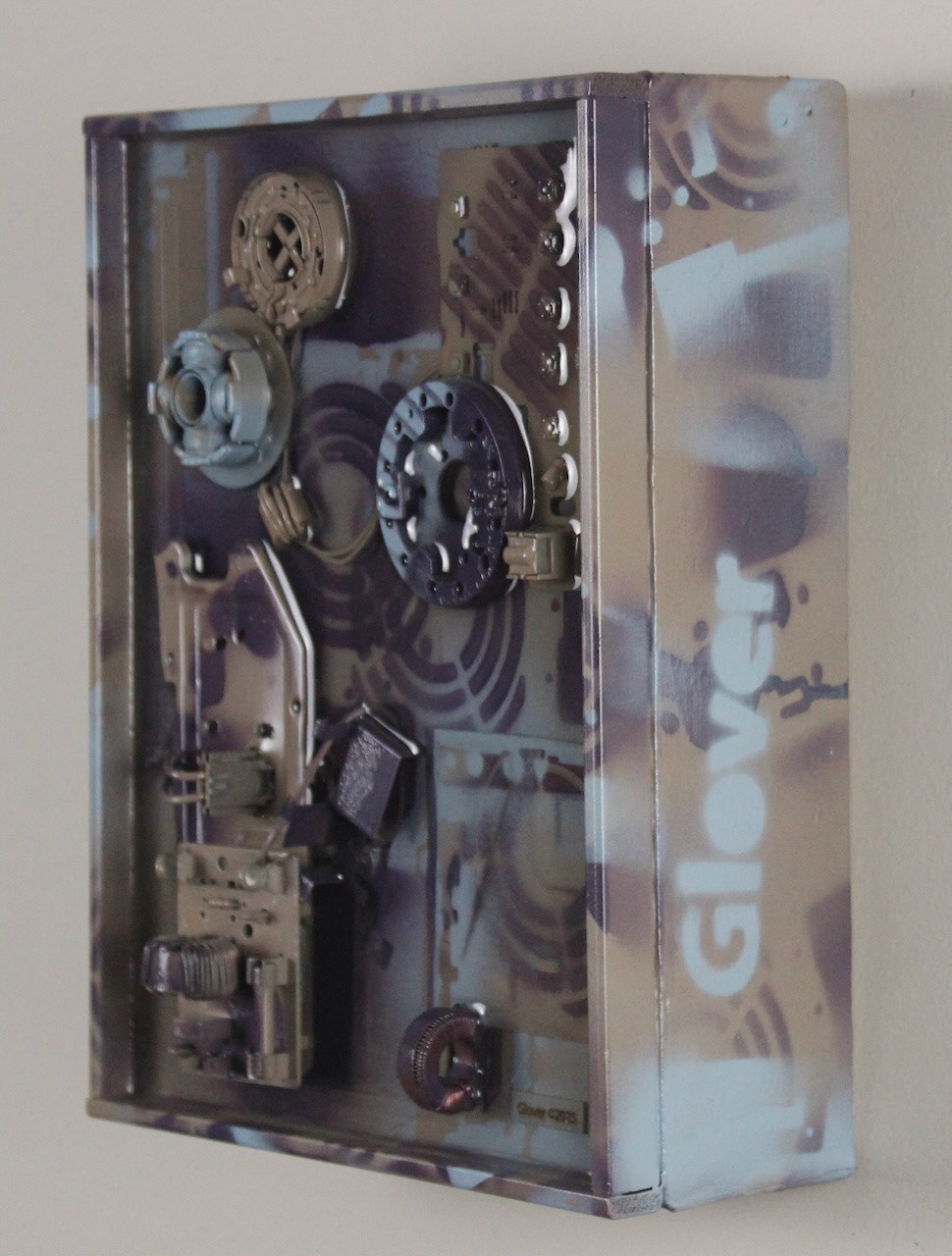 Times and Seasons; SOLD (H:12” x W:9” x D:5”) Assorted machine and computer parts, license plate section, spray paint, epoxy resin, canvas covered wood frame