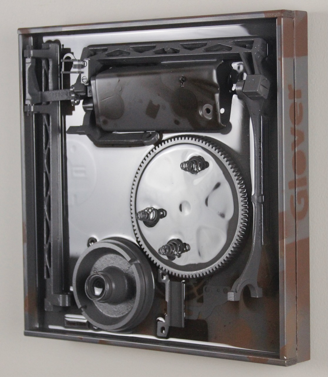 Deep Springs Below; $940 (H:12” x W:12” x D:2.75”) Assorted machine parts, spray paint, epoxy resin, wood base