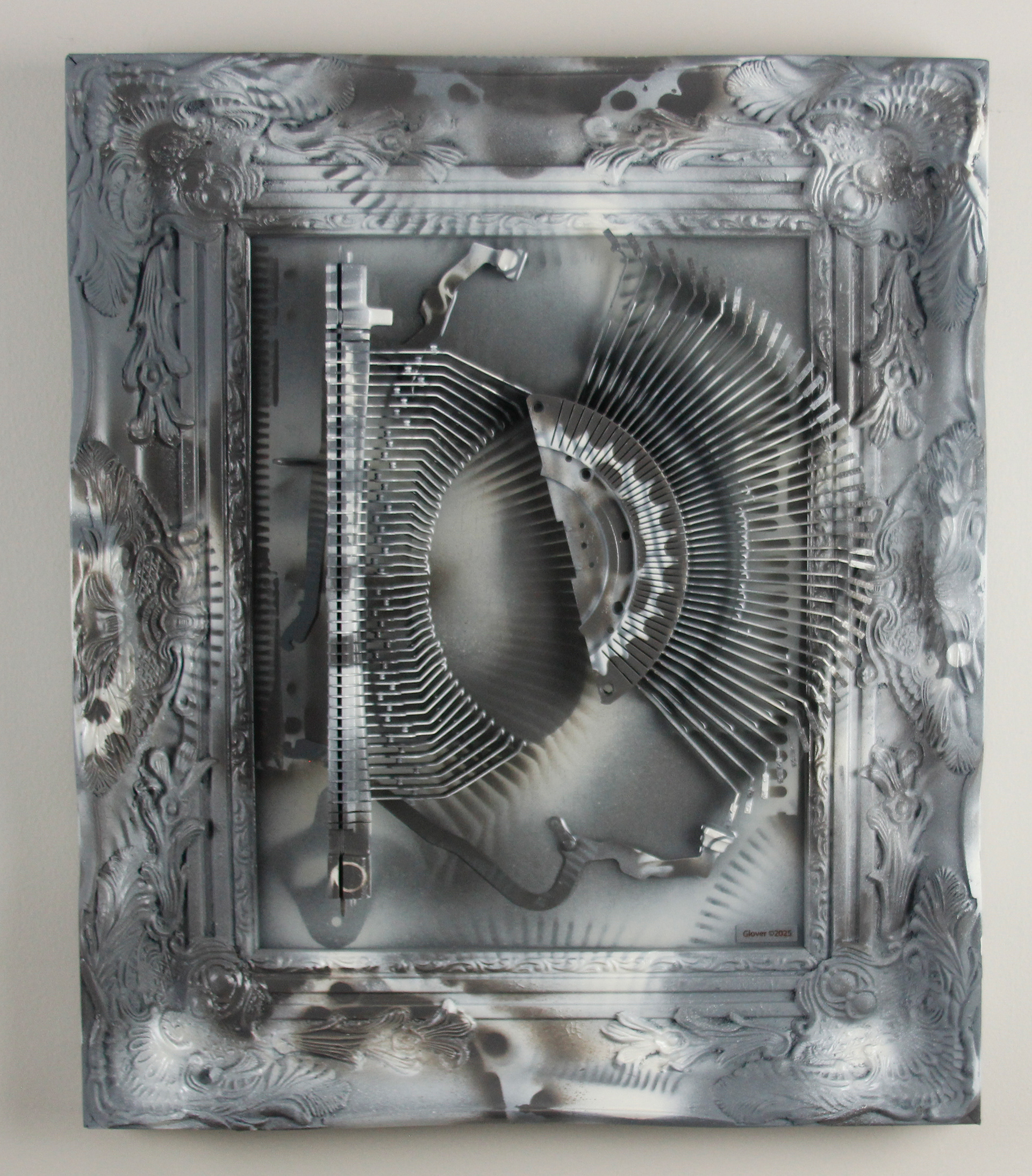 Shifting Satiation; $2200 (H:20” x W:17” x D:2.5”) Typewriter parts, spray paint, epoxy resin, wood base 