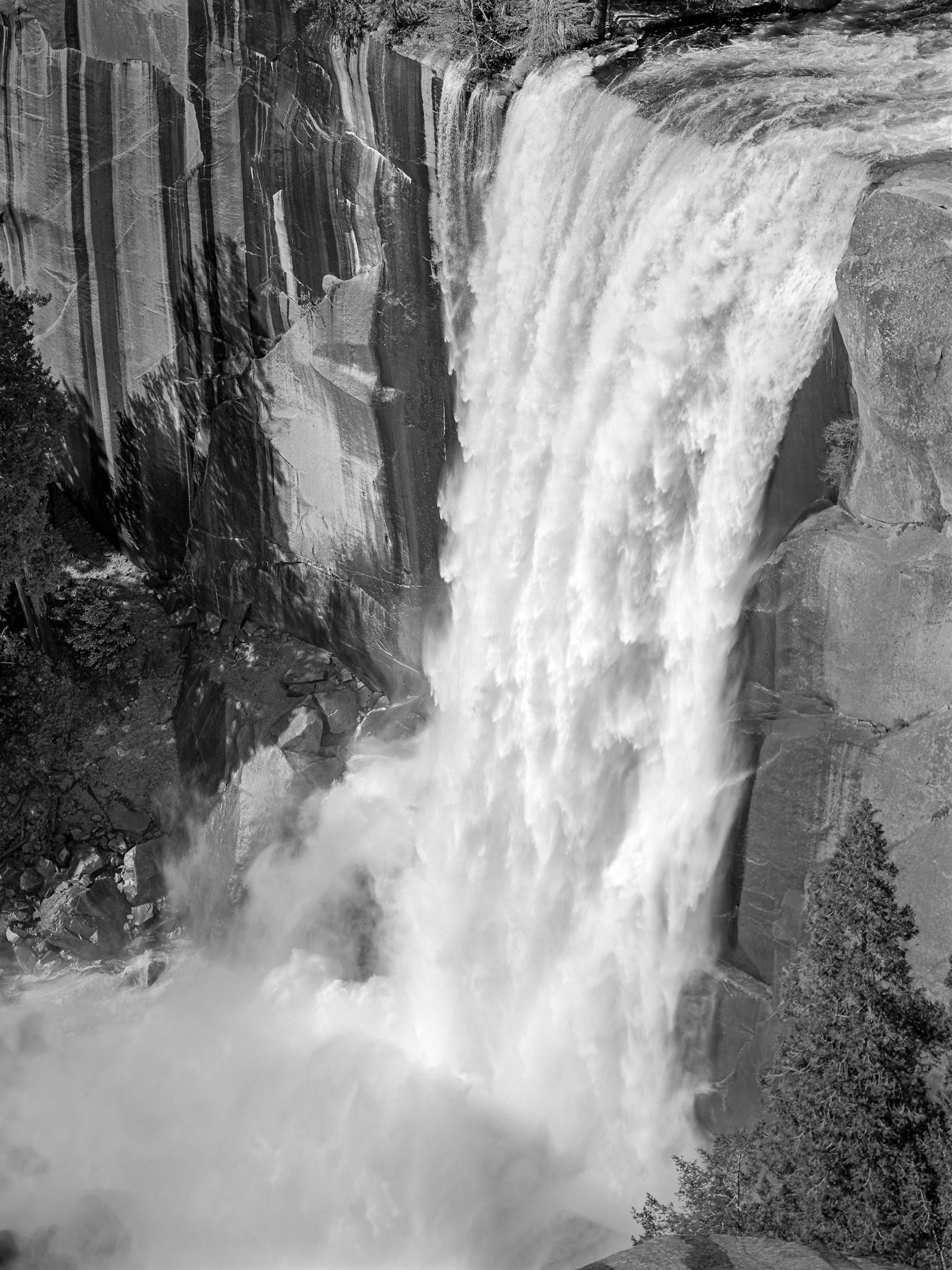 Water plummets over the rock face of Vernal Falls in Yosemite.
