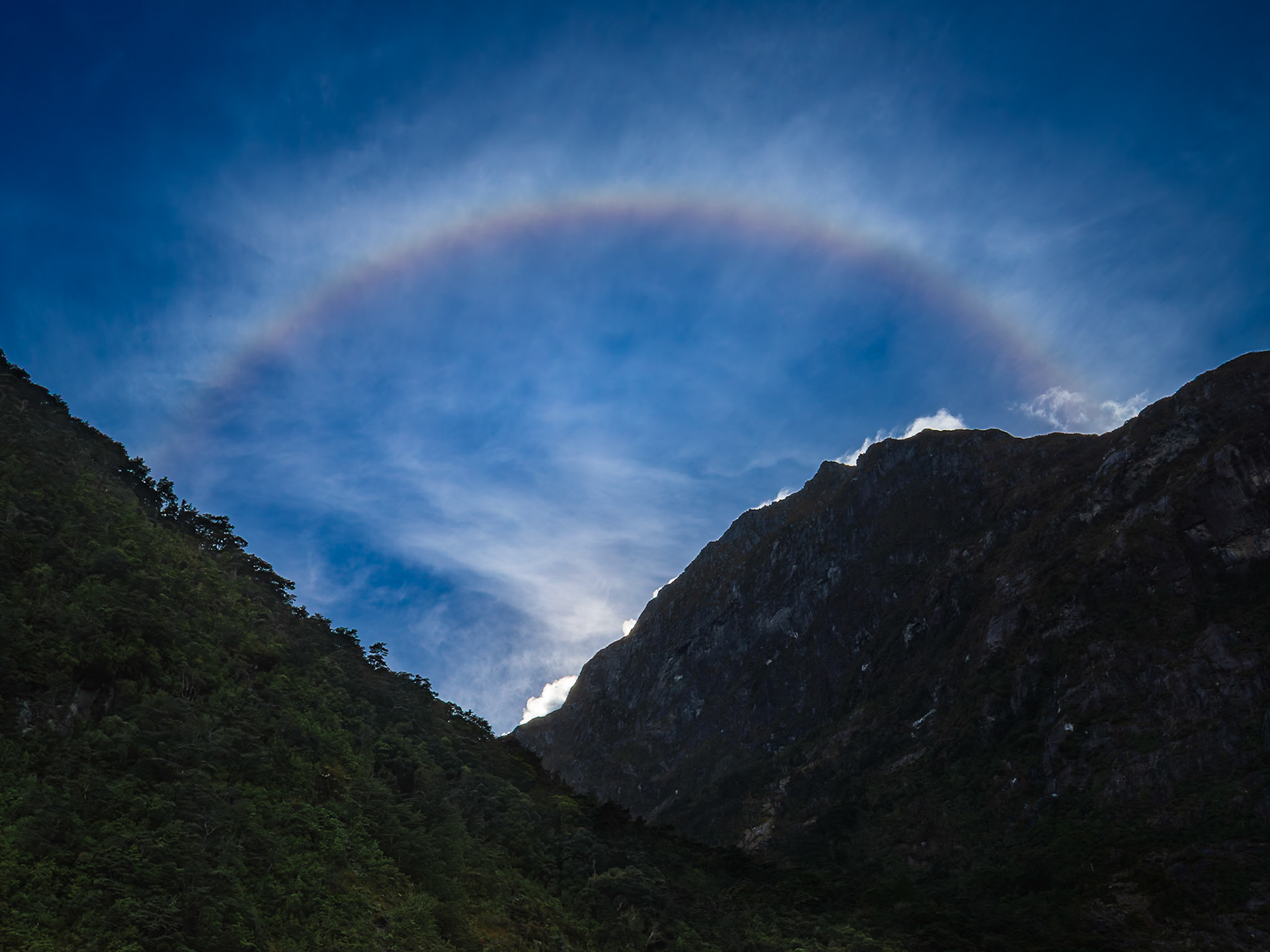 Ice crystals create a sun halo in the morning skies over Fiordland National Park.