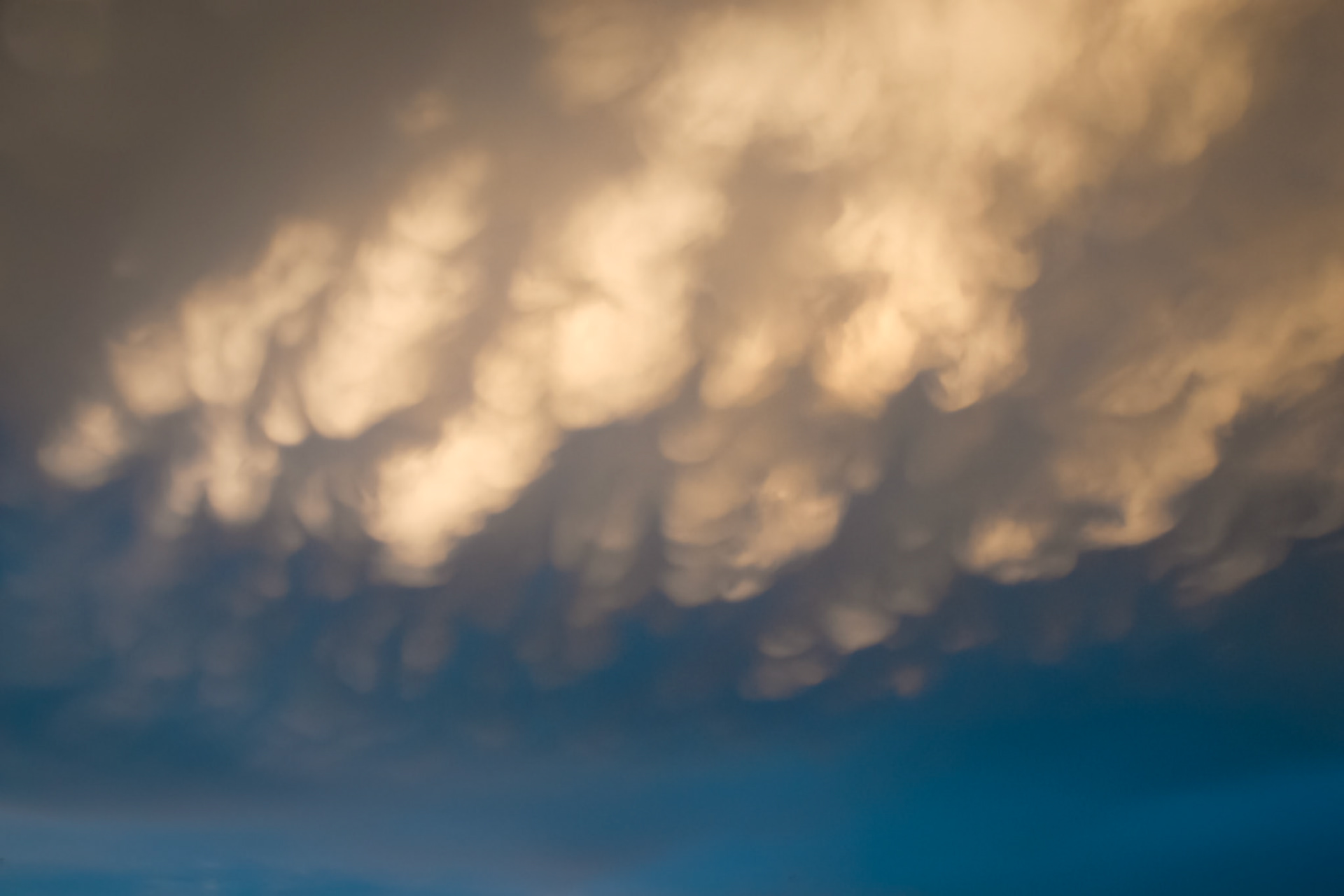 Fading evening light illuminates mammatus cloud formwations.
