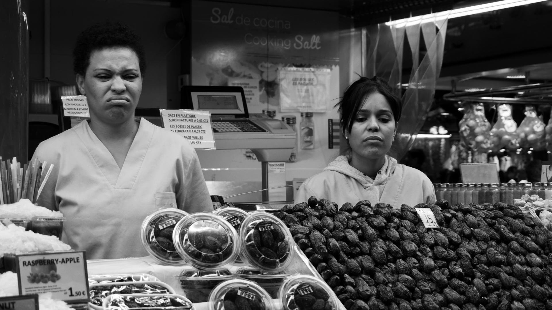black and white street photography of two sales women in Barcelona Spain