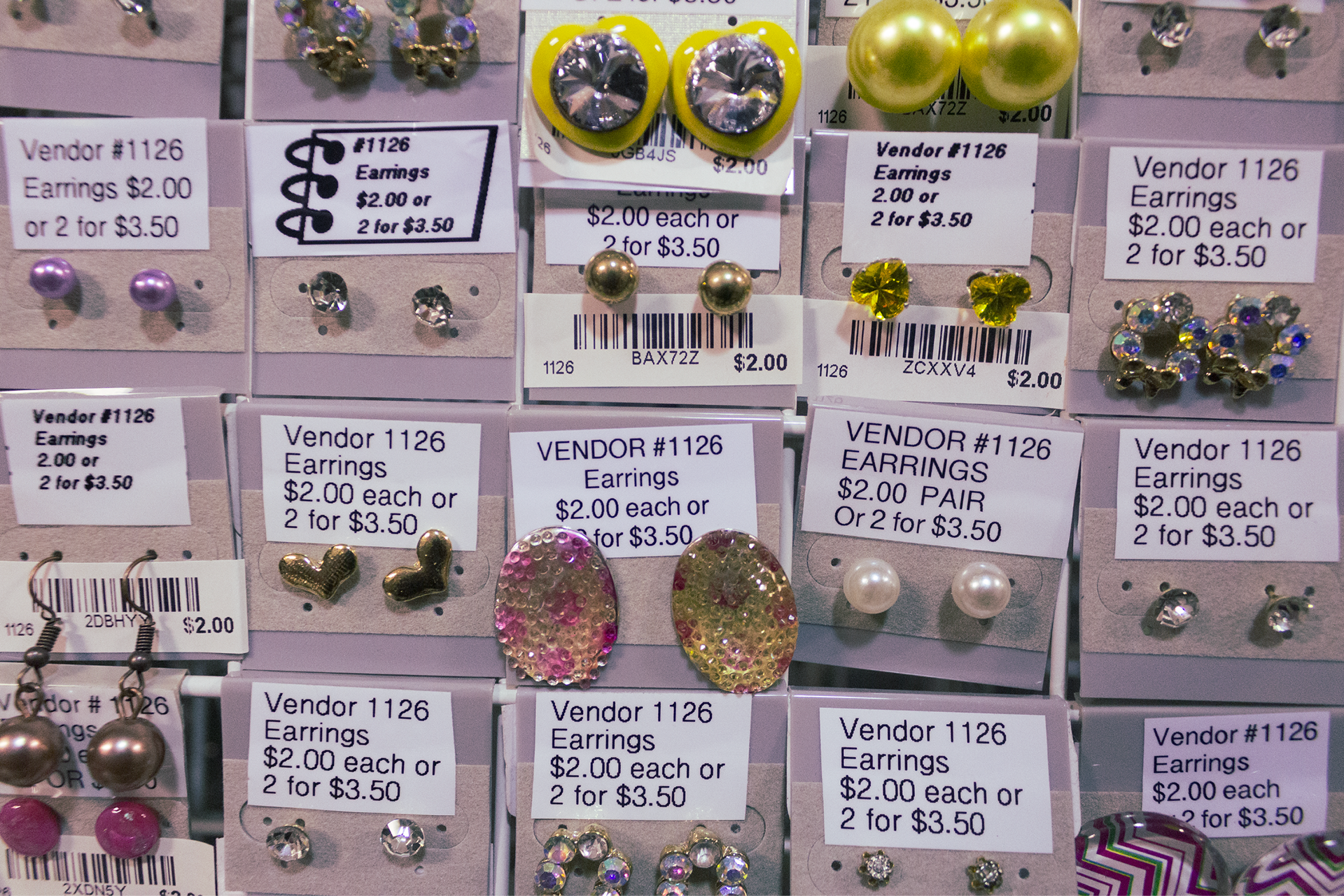 Rows of earrings, new and old, fill a shelf.