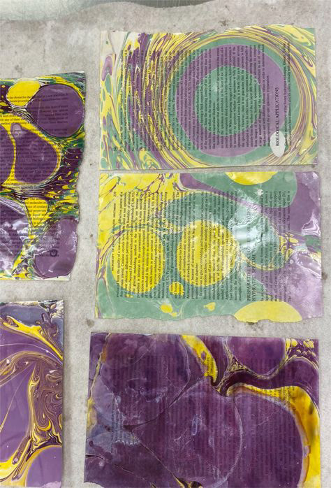 Paper marbling studies using book pages and pigment.