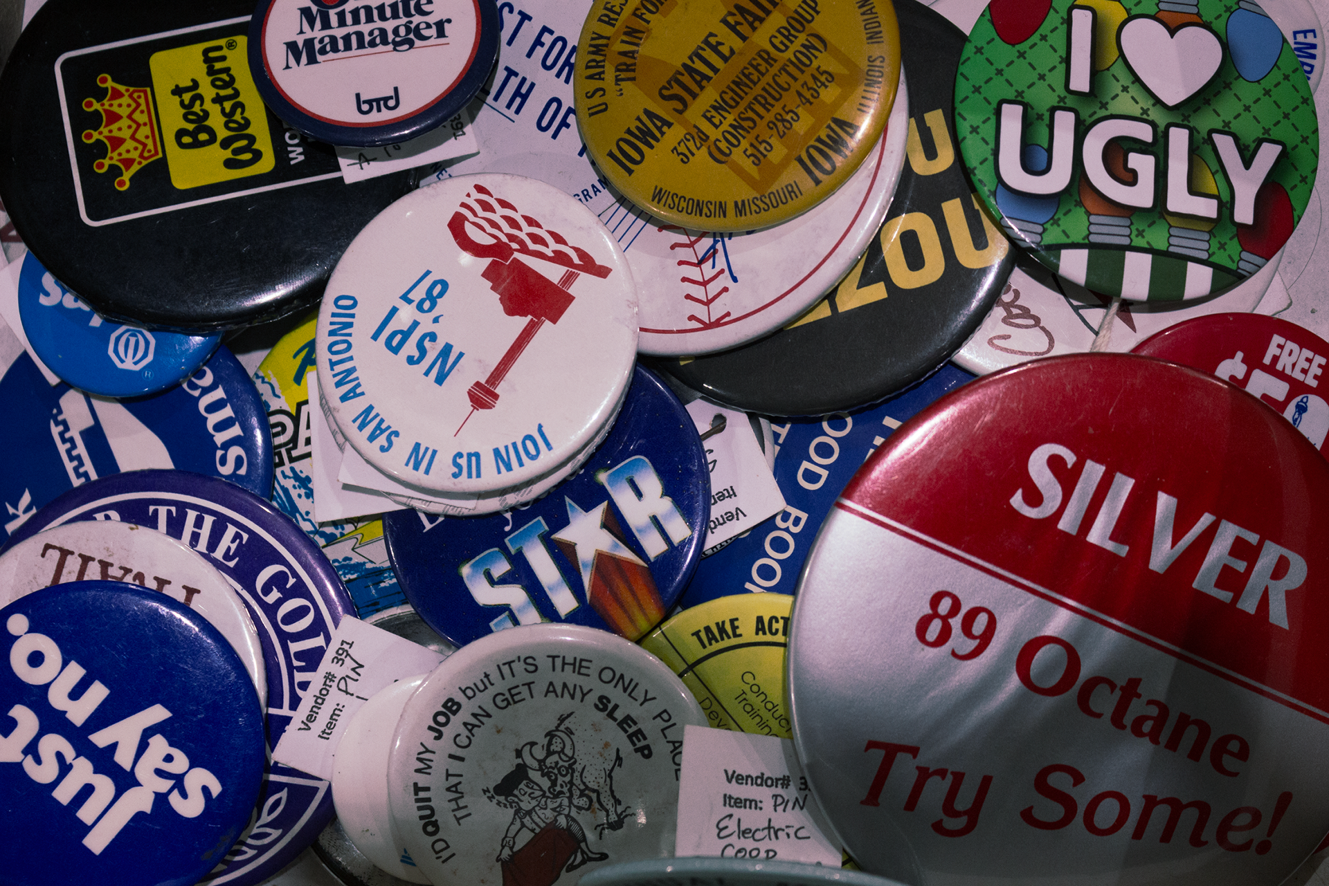 A box of buttons becomes a scrapbook of historical events and locations.