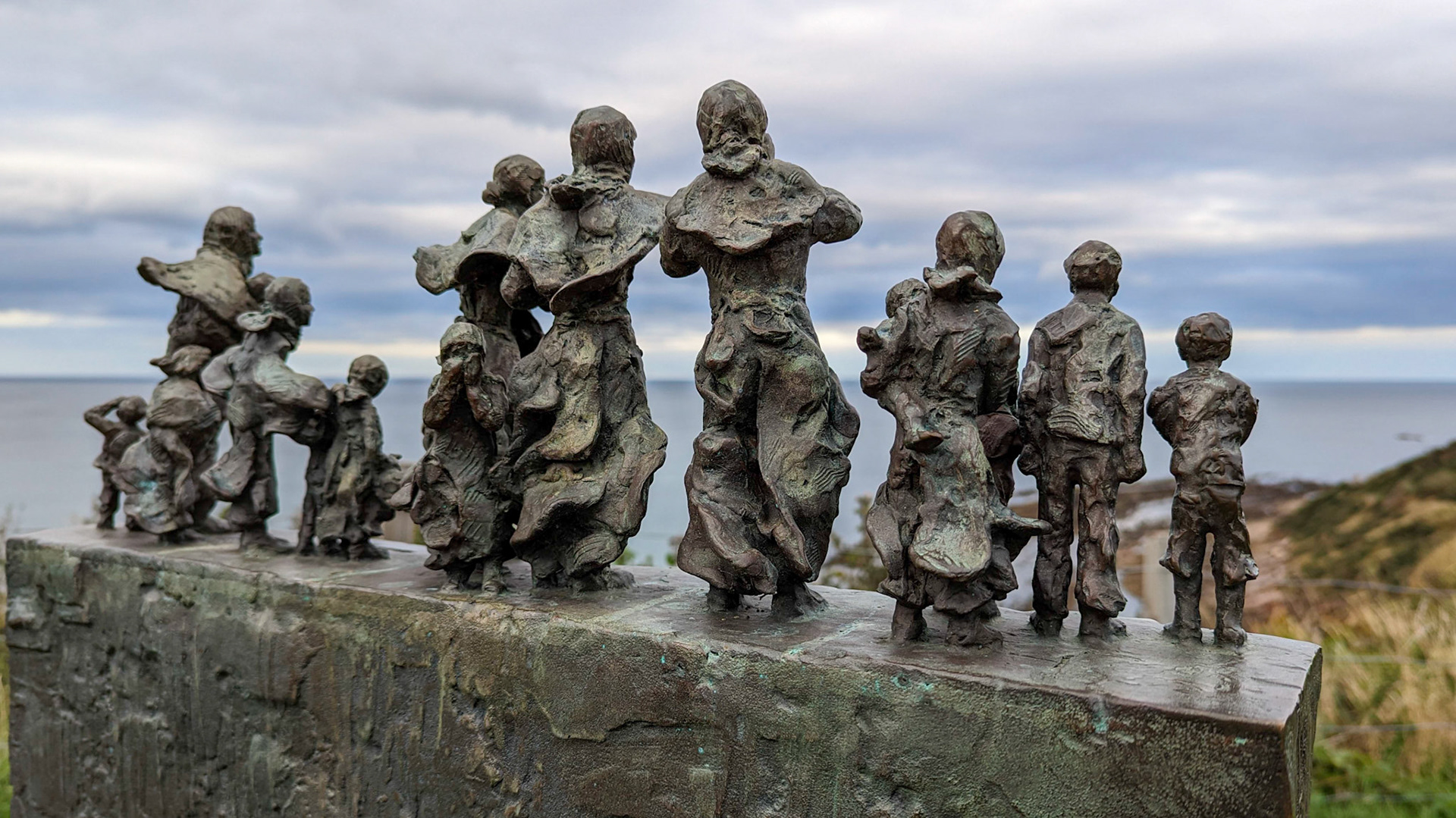 'These sculptures located at Cove, Burnmouth and St Abbs, commemorate the widows and bairns left behind by the great storm of October 14th 1881. Scotland suffered her worst fishing disaster and the Berwickshire ports lost a total of 189 men, many within sight of their loved ones.'