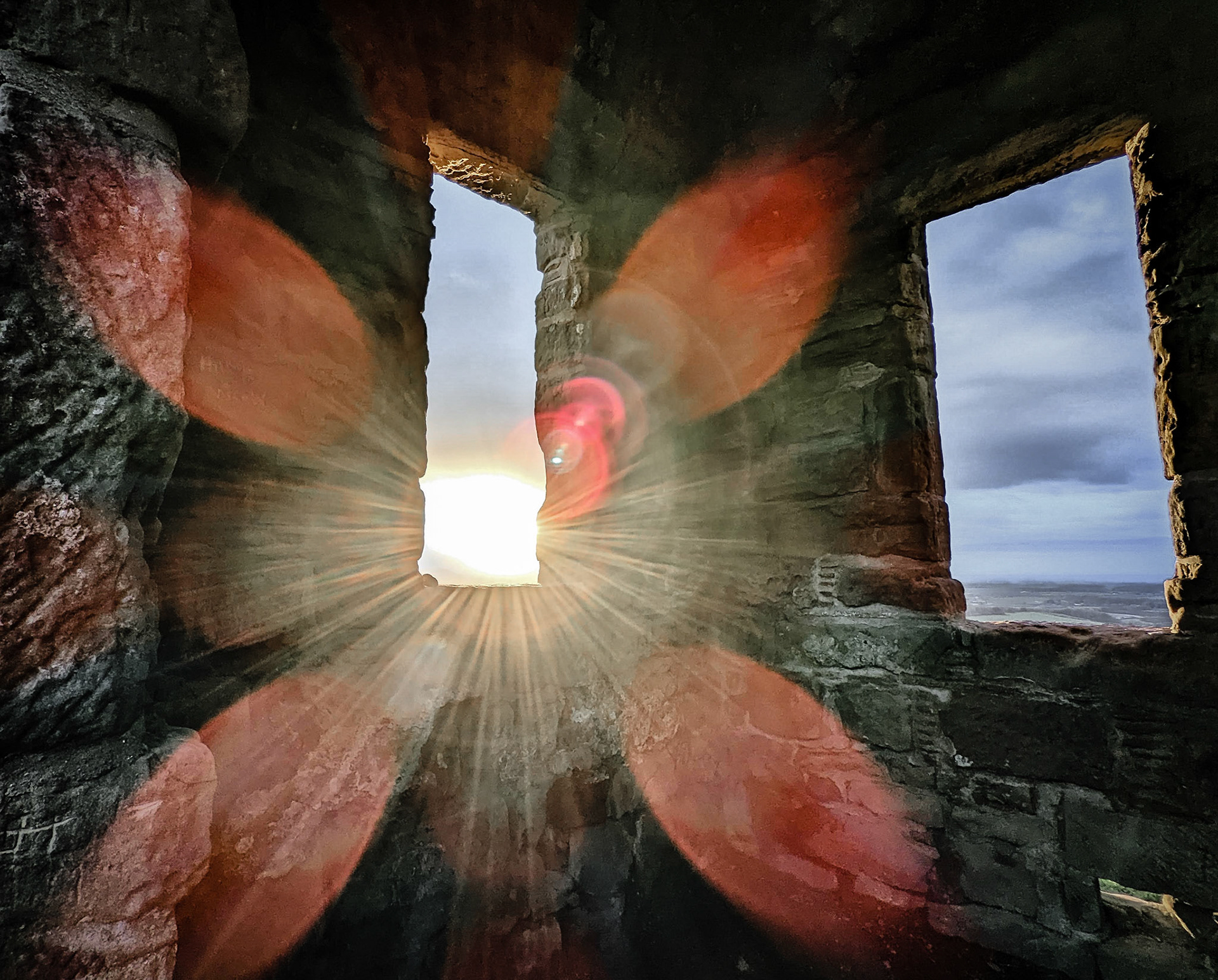 Inside Roseberry Topping shooting box at sunset