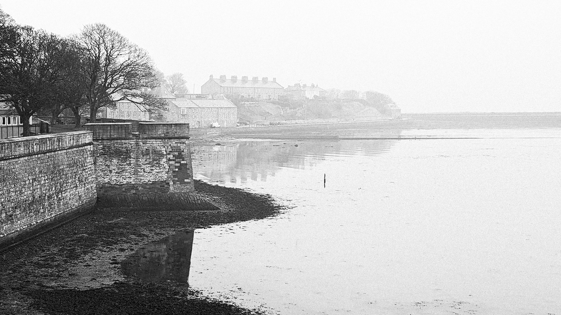 Looking along the town walls to misty Tweedmouth. This album shows the Old Bridge (1524), the Royal Tweed Bridge (1928) and the Royal Border Bridge (1850).