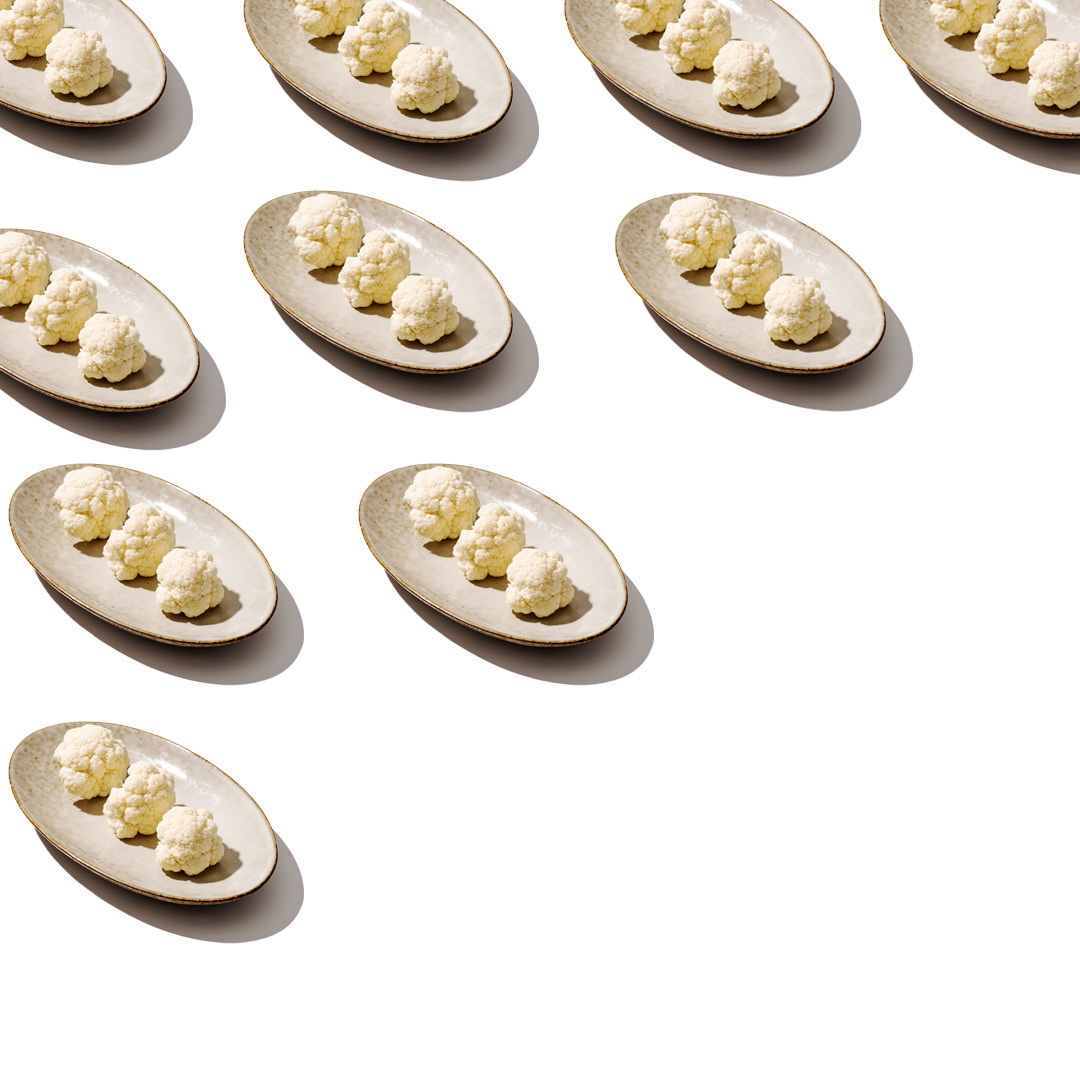 cauliflower pattern on a white background. Lifestyle photo by Uliana Kopanytsia for baby food app