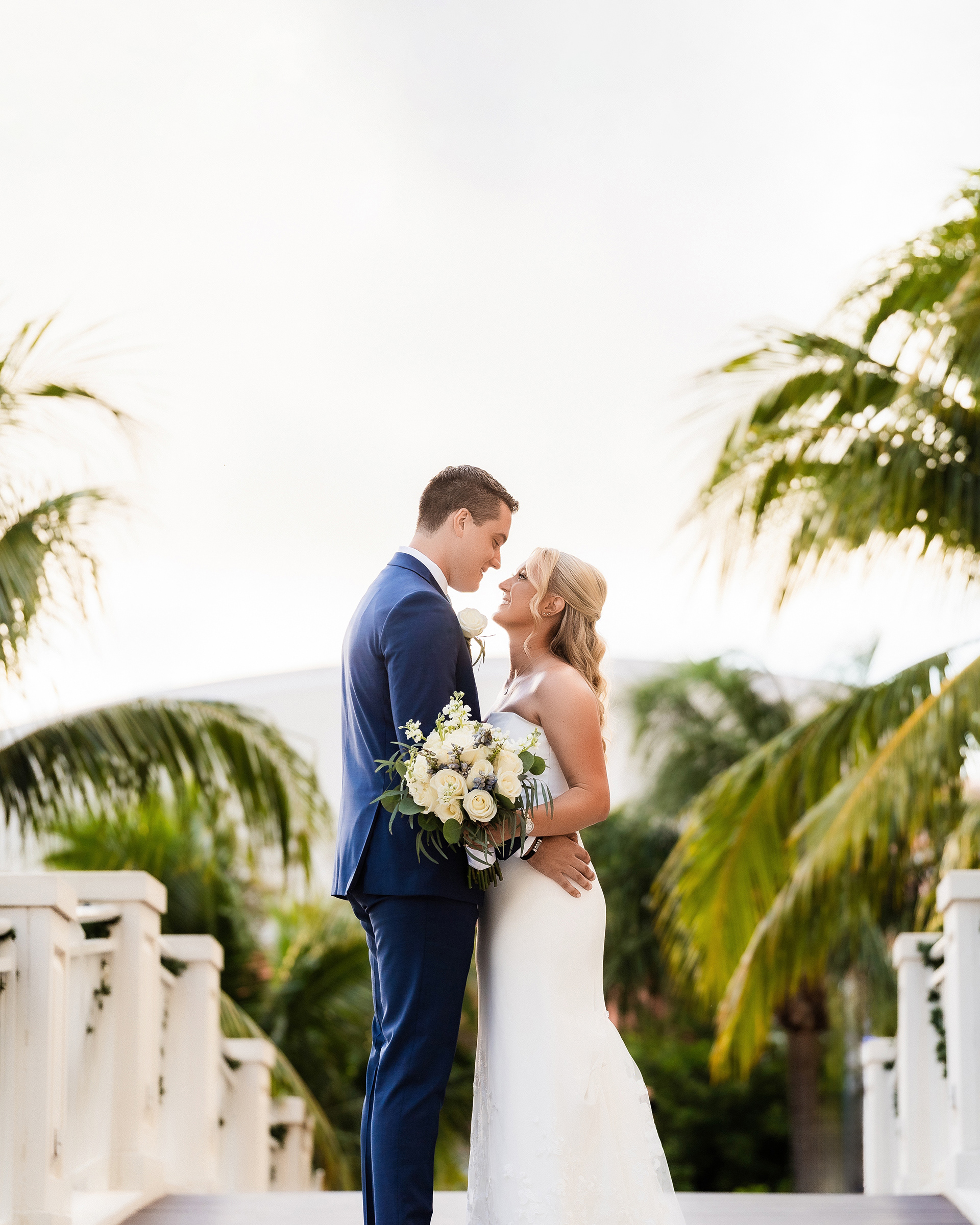 Framed by palms, lit by love — a quiet pause before forever begins.
