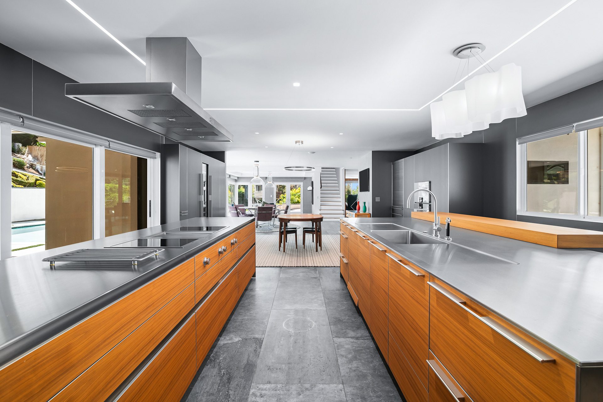 Modern kitchen design photography featuring custom pendant lighting and open dining space in Murrieta - Andrew Crippen Visuals