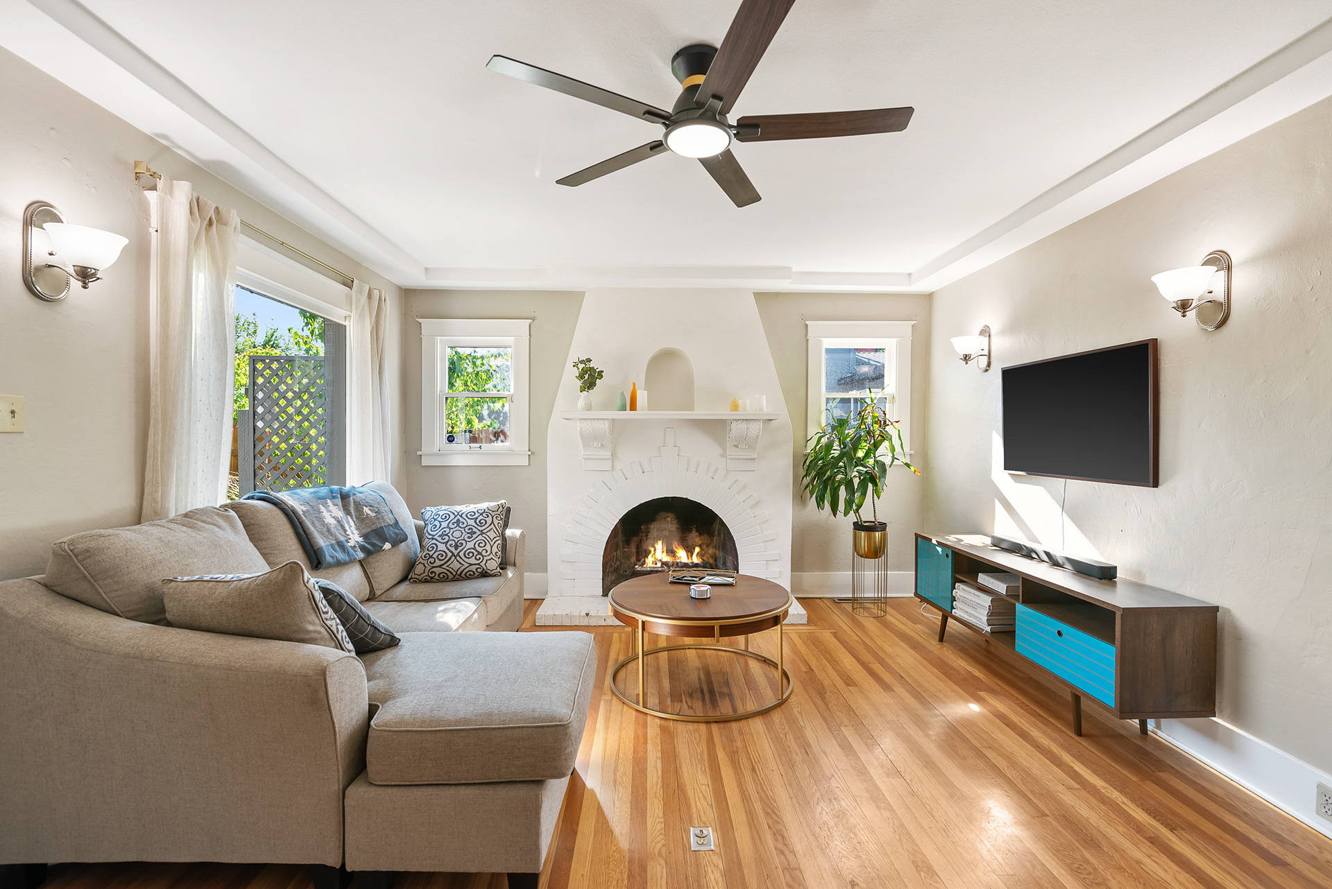 Interior real estate photography of cozy modern living room featuring a stylish fireplace in Murrieta city home - Andrew Crippen Visuals