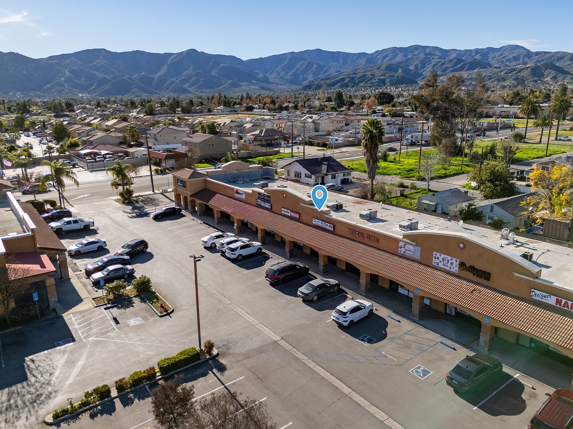 Aerial of a strip retail center and parking lot in Lake Elsinore, CA