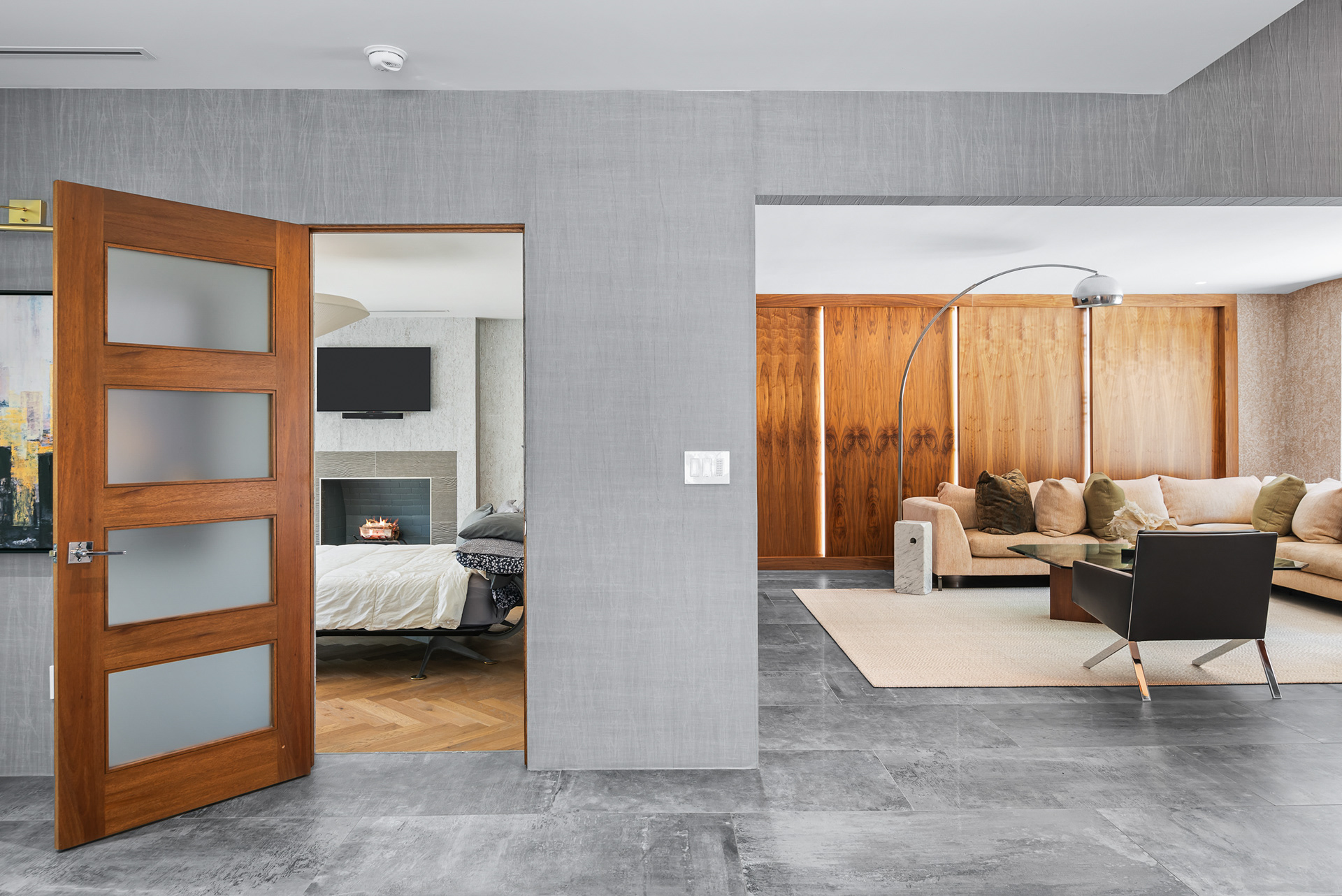 Modern home interior shot showing entryway living space and open master bedroom door in Temecula listing