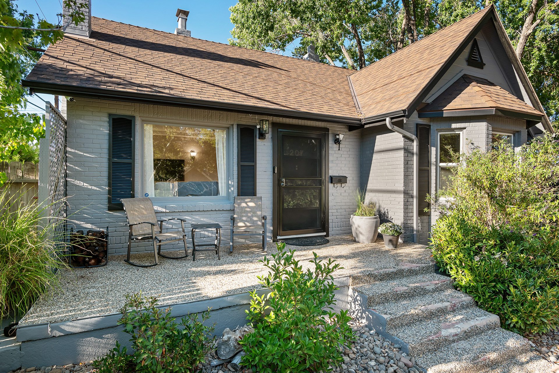 Exterior real estate photography of cozy modern city home featuring an inviting front porch with seating in Temecula - Andrew Crippen Visuals