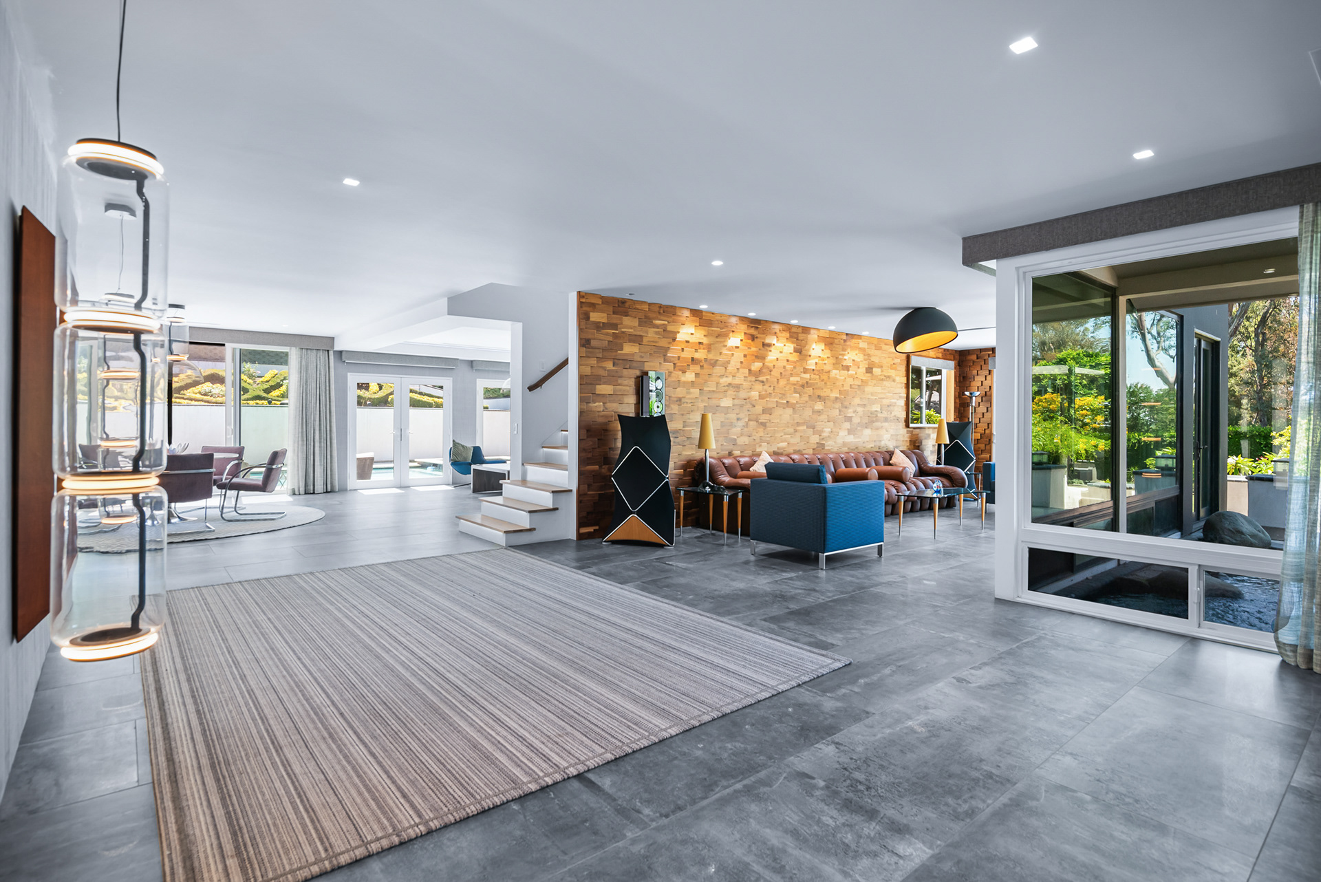 Luxury audiophile listening room featuring $250,000 Bang & Olufsen sound system and view of koi pond in La Cresta estate - Andrew Crippen Visuals