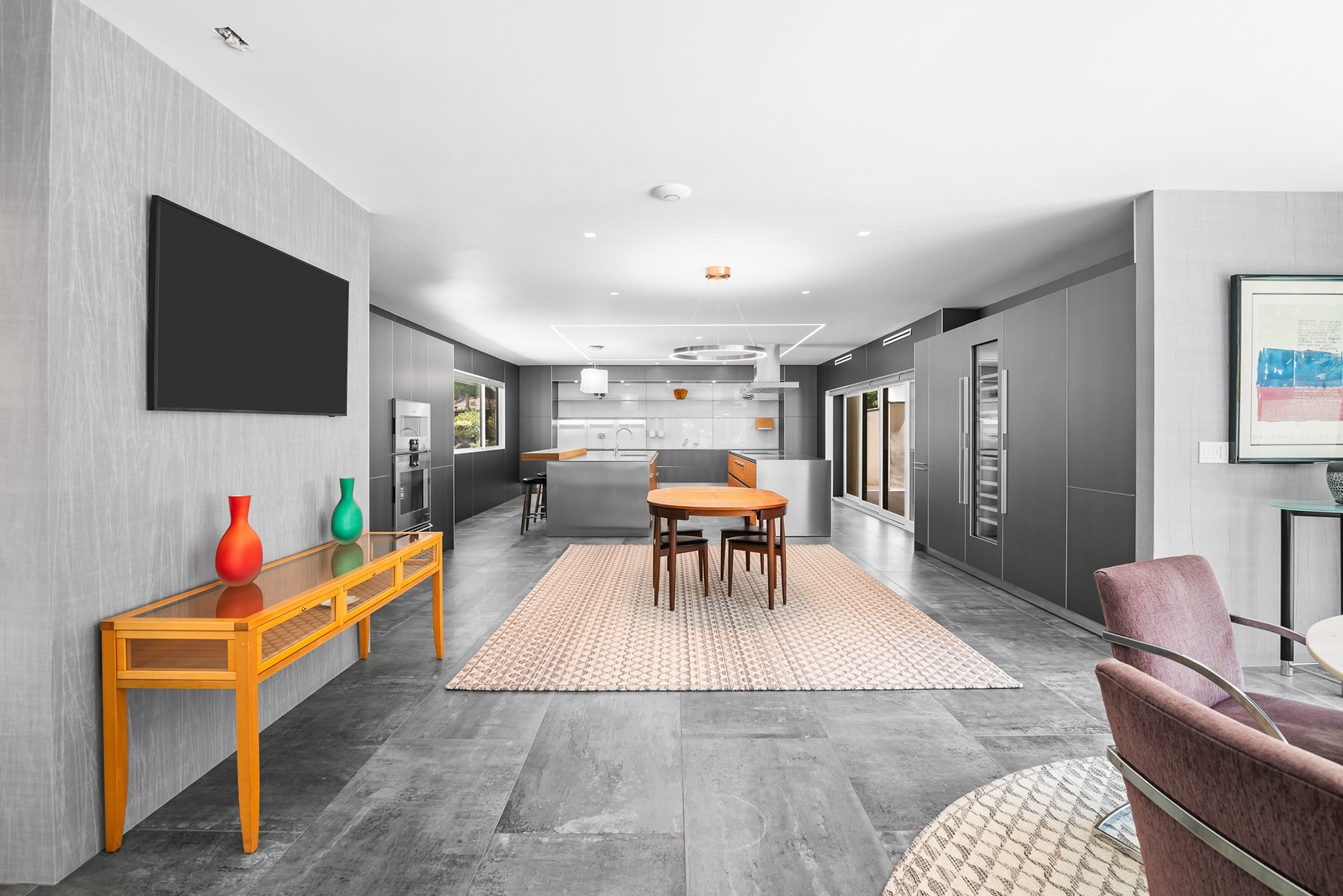 Interior real estate photography of ultra-modern kitchen with floor-to-ceiling stainless steel cabinetry in La Cresta luxury estate - Andrew Crippen Visuals