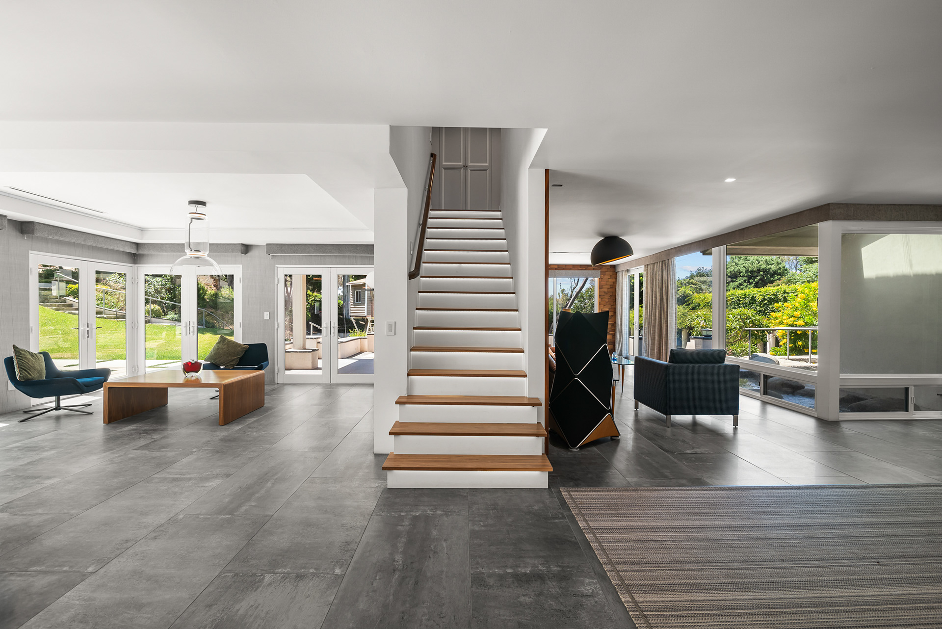 "Architectural photography of modern staircase with custom LED tread lighting in La Cresta estate - Andrew Crippen Visuals