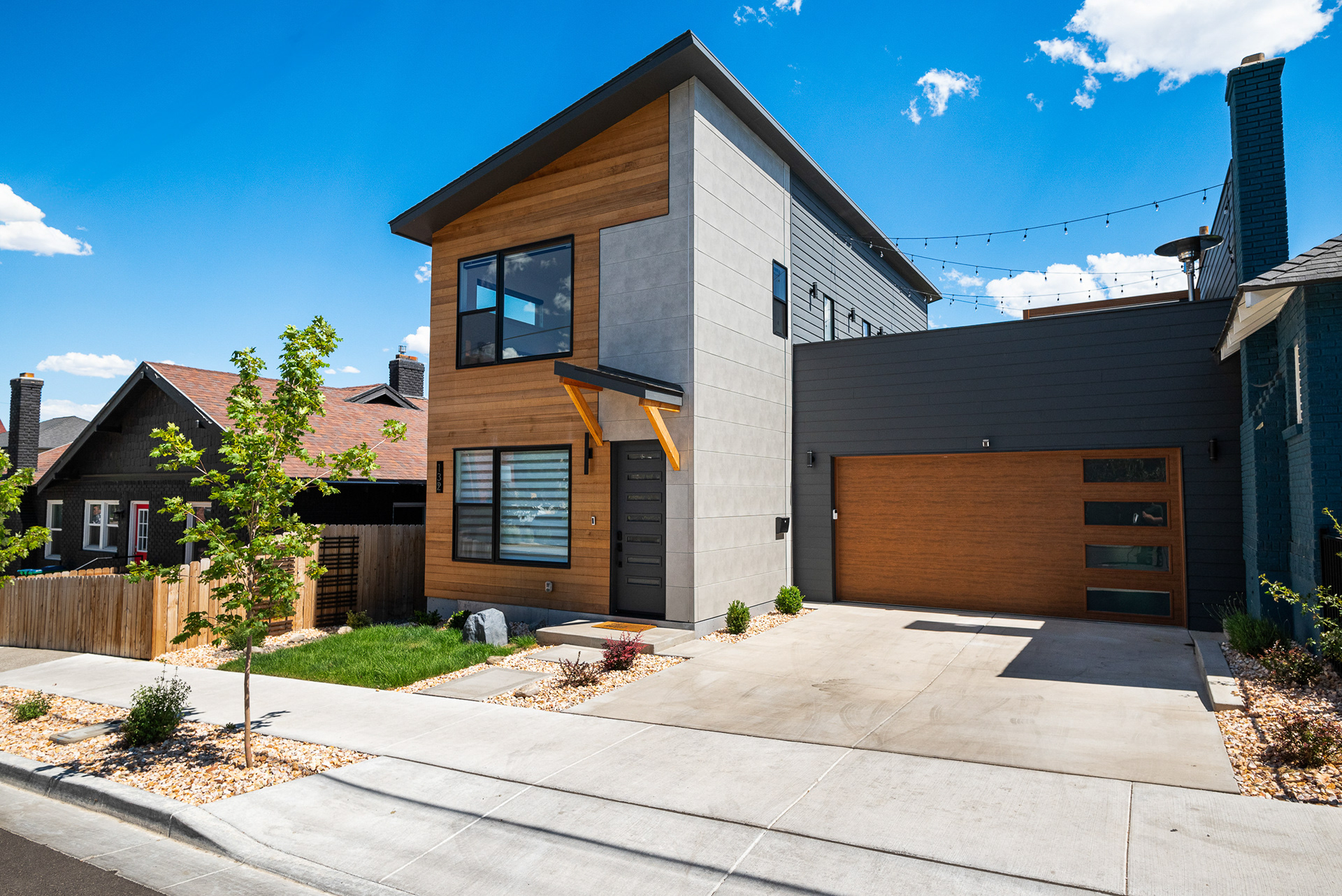 Exterior real estate photography of ultra-modern city home featuring a sleek modern garage door and contemporary facade in Temecula - Andrew Crippen Visuals