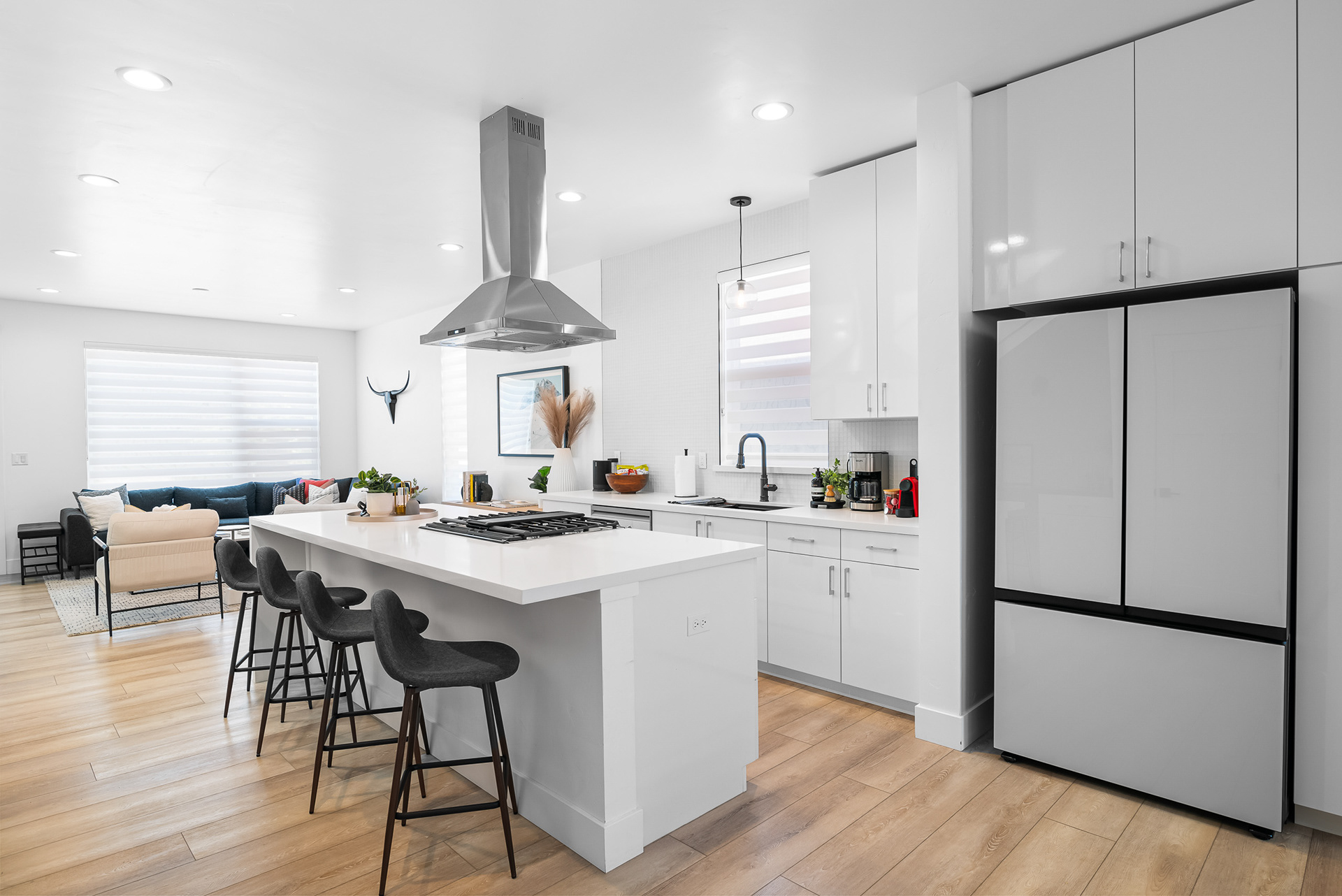 Interior real estate photography of modern quartz kitchen island featuring stylish barstool seating in Temecula city home - Andrew Crippen Visuals