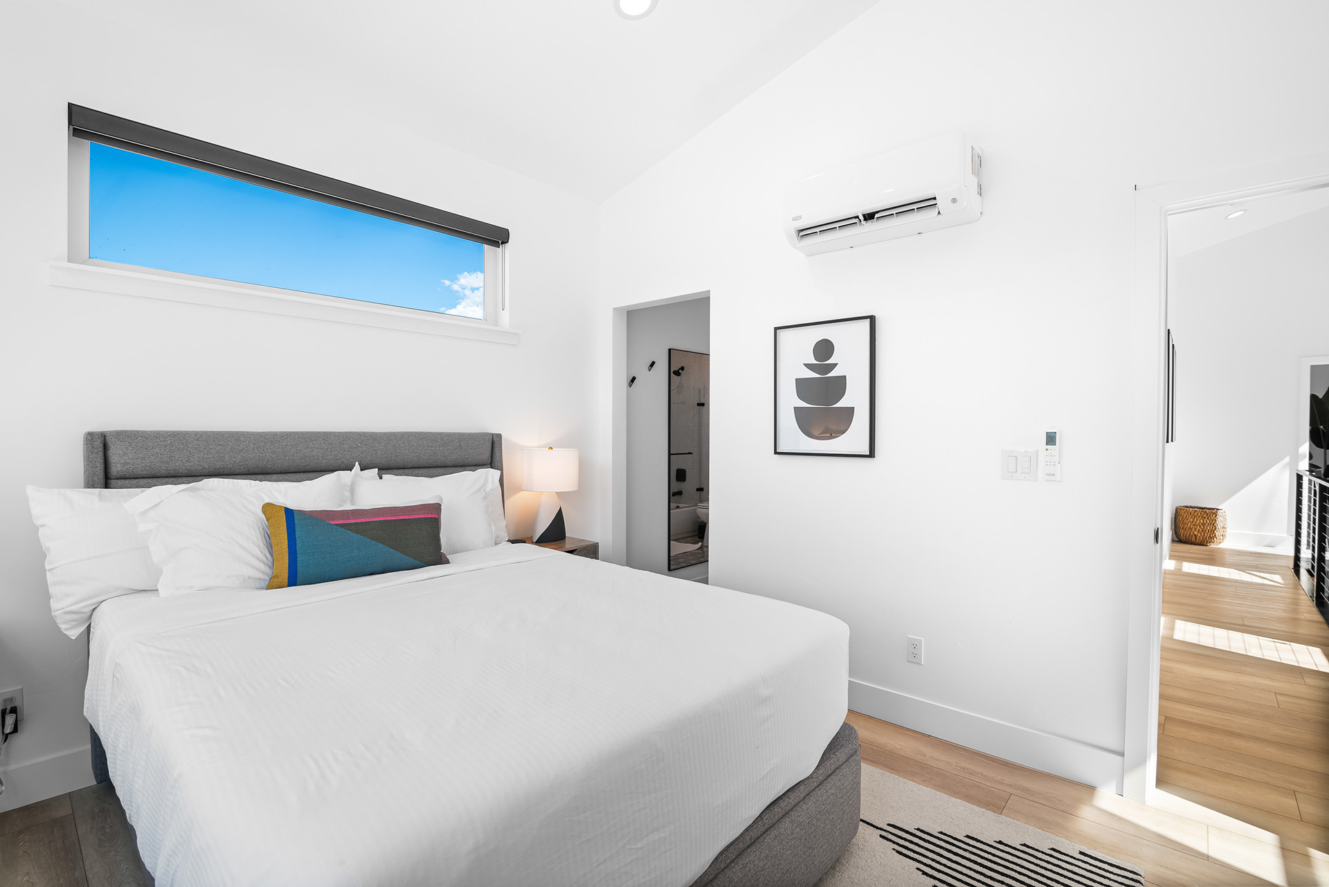 Interior real estate photography of modern secondary guest suite with private ensuite bathroom and large windows in Murrieta - Andrew Crippen Visuals